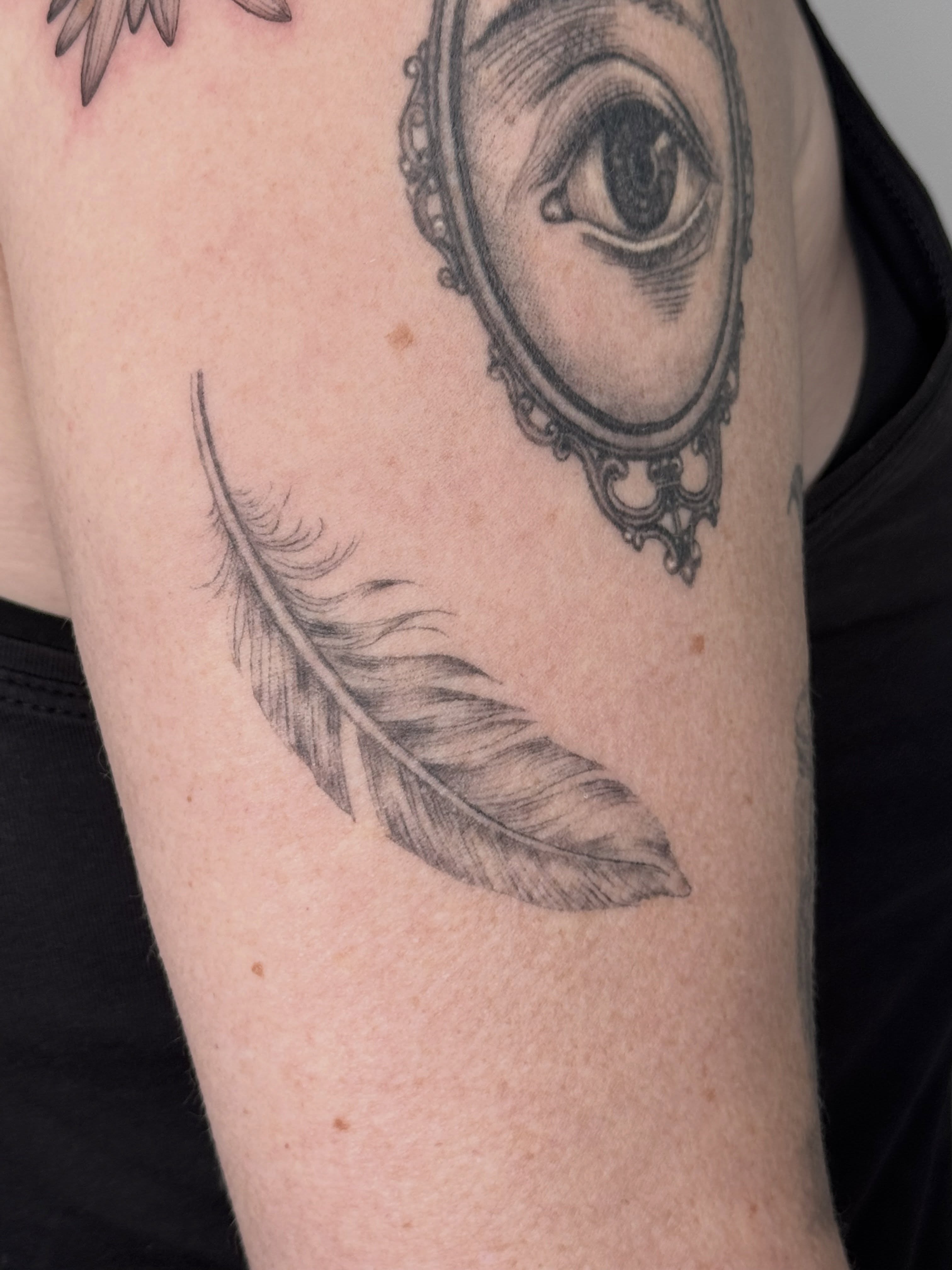 Eye in mirror realism tattoo on the forearm by Ashley Limon
