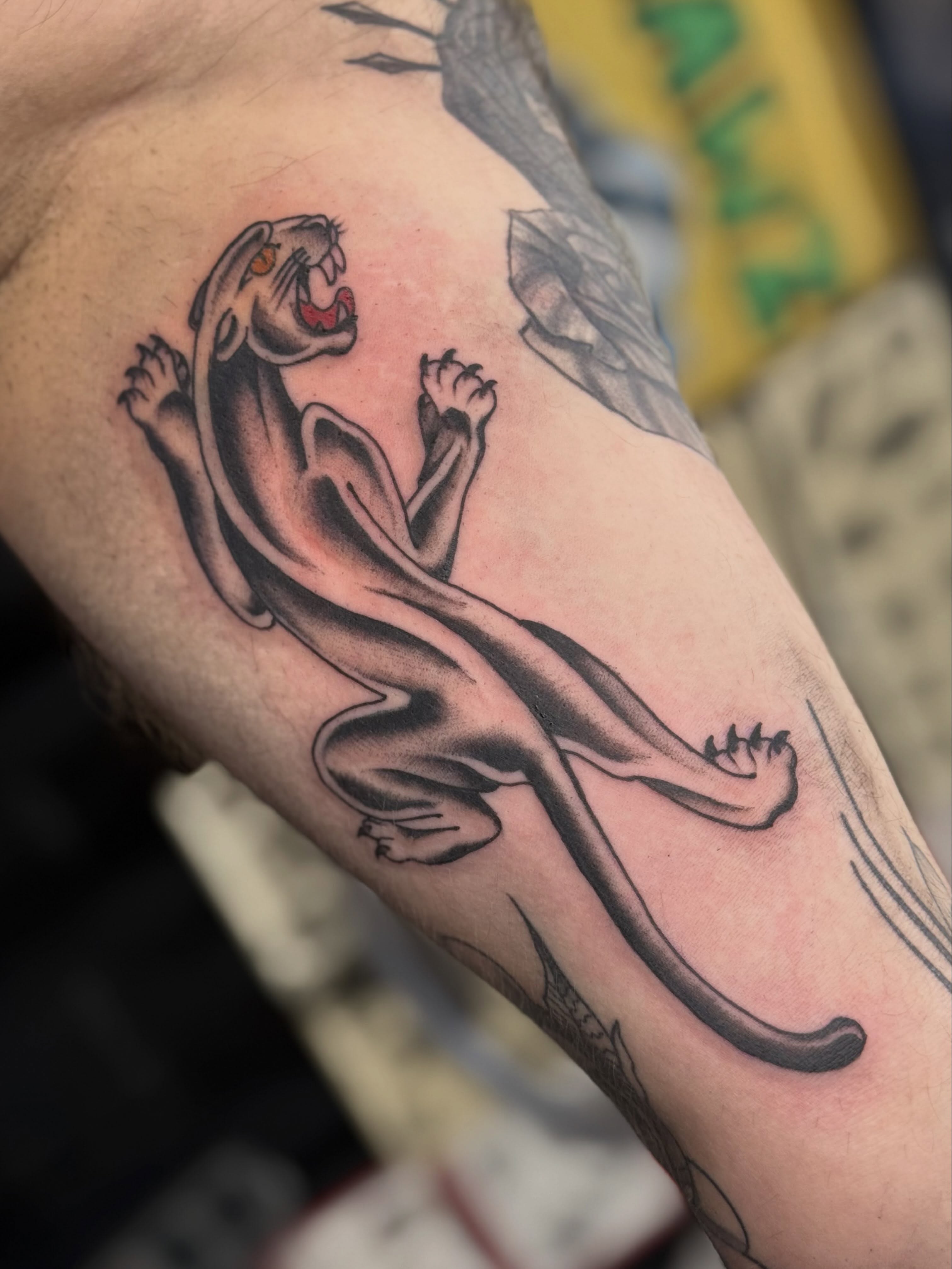 Panther black and grey tattoo on the forearm by Sarah Christine Tattoo, Calgary, Alberta