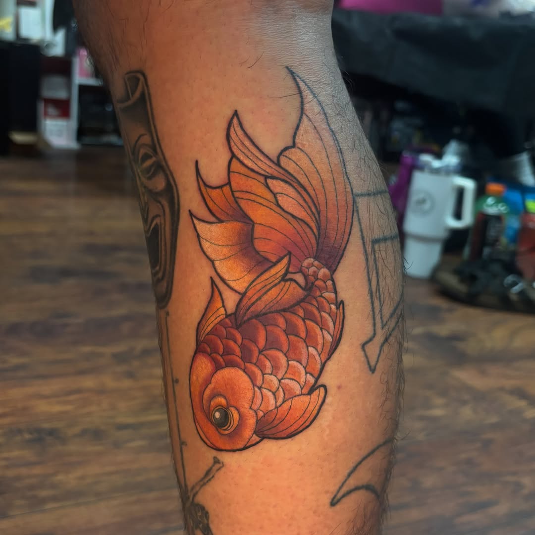 Goldfish American traditional tattoo on the forearm by Emma ๐