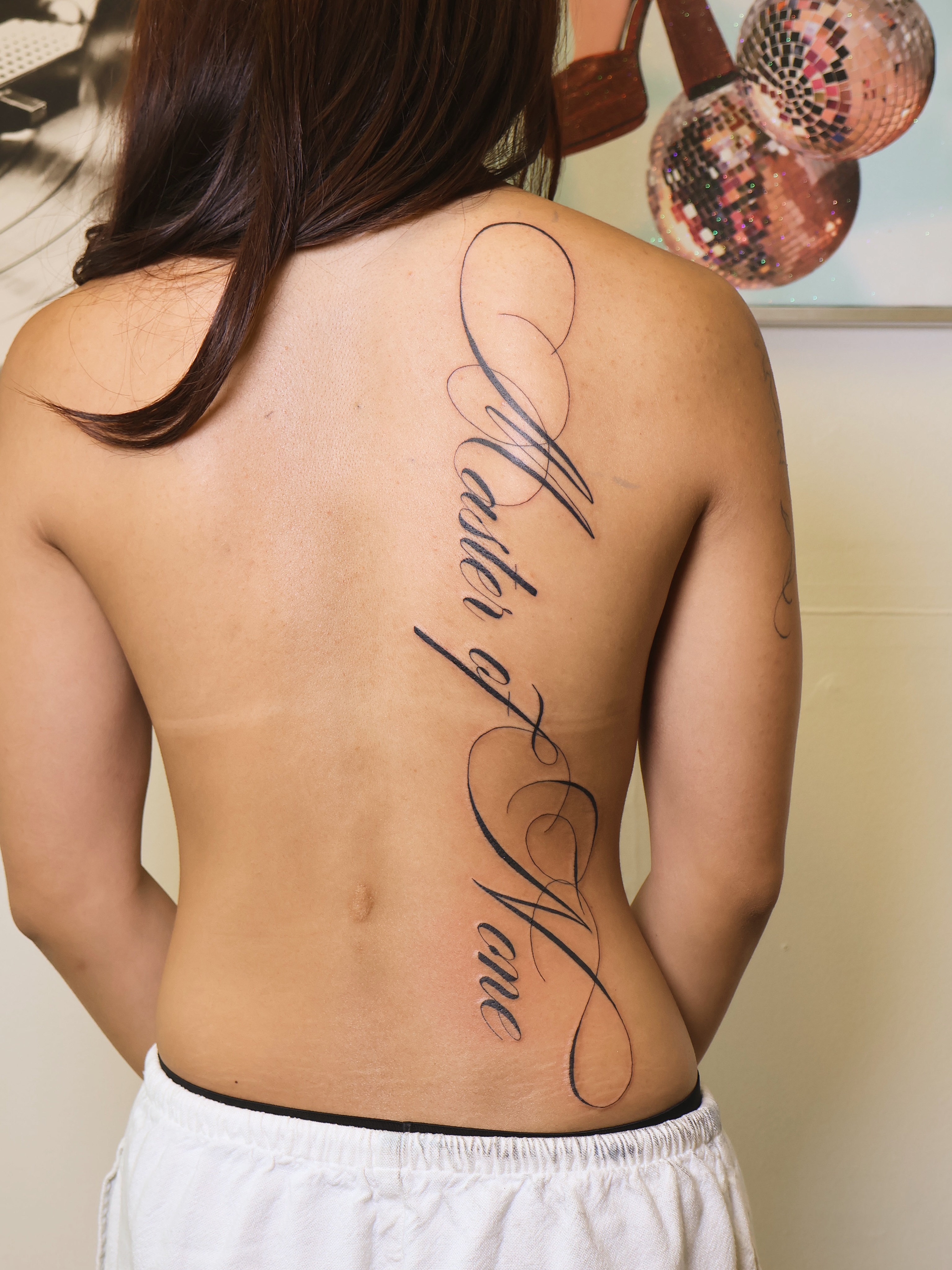Tattoo by @divinebeautybarbyaly — lettering_script