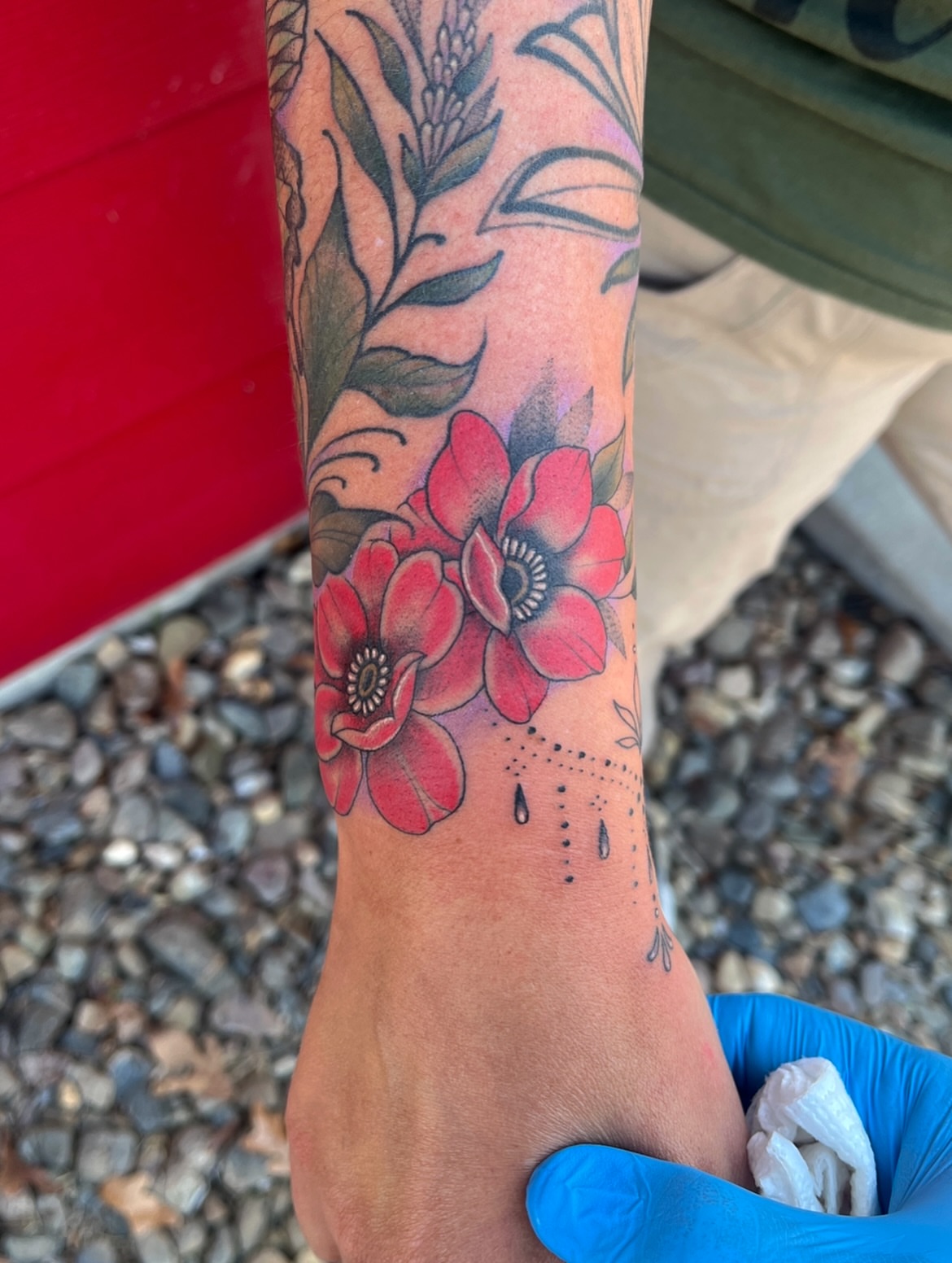 Red flowers dotwork tattoo on the forearm by Timmy