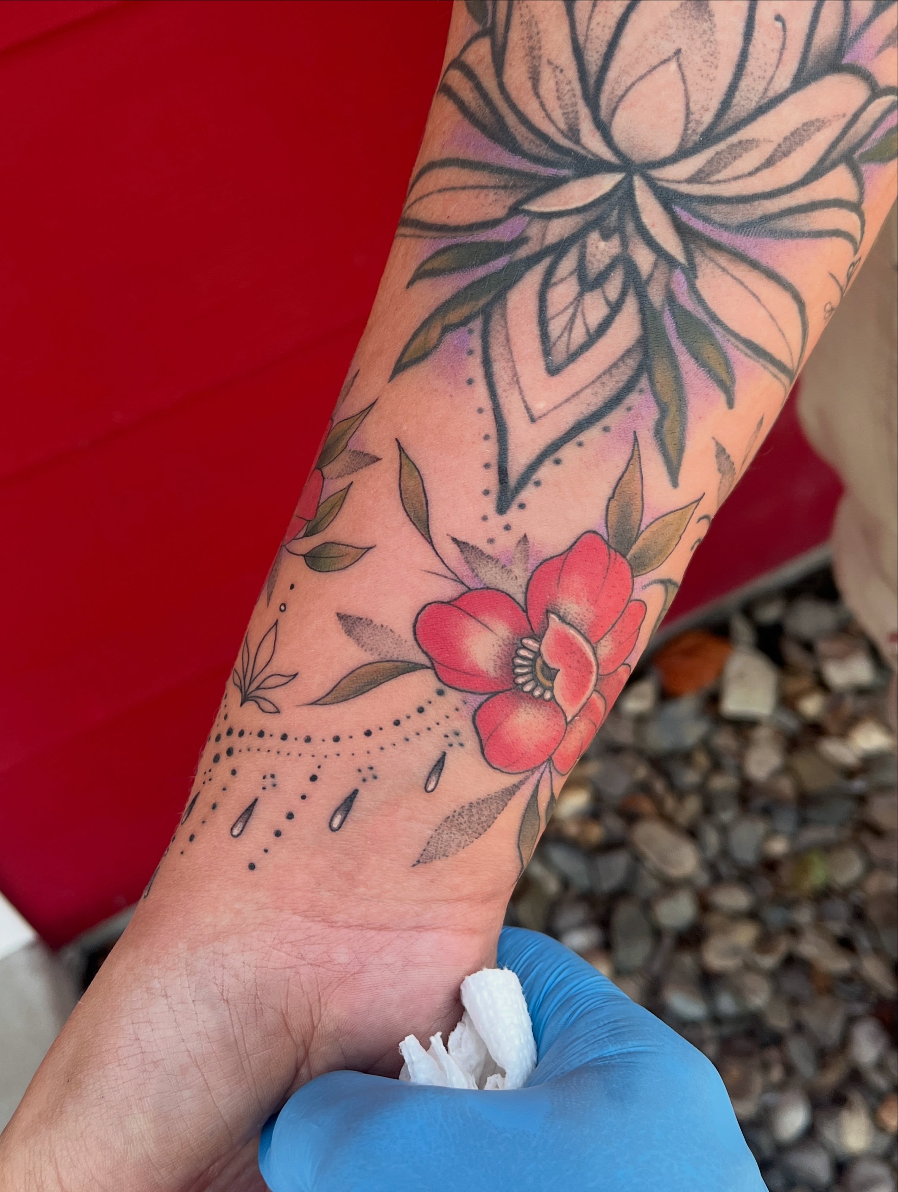 Lotus flower dotwork tattoo on the forearm by Timmy