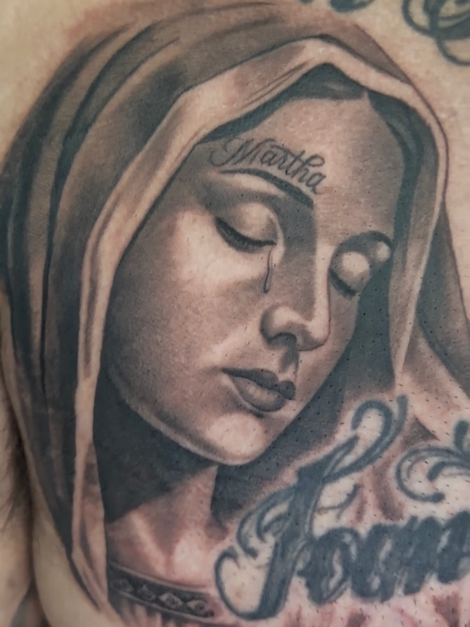 Woman's face realism tattoo on the chest by Vic