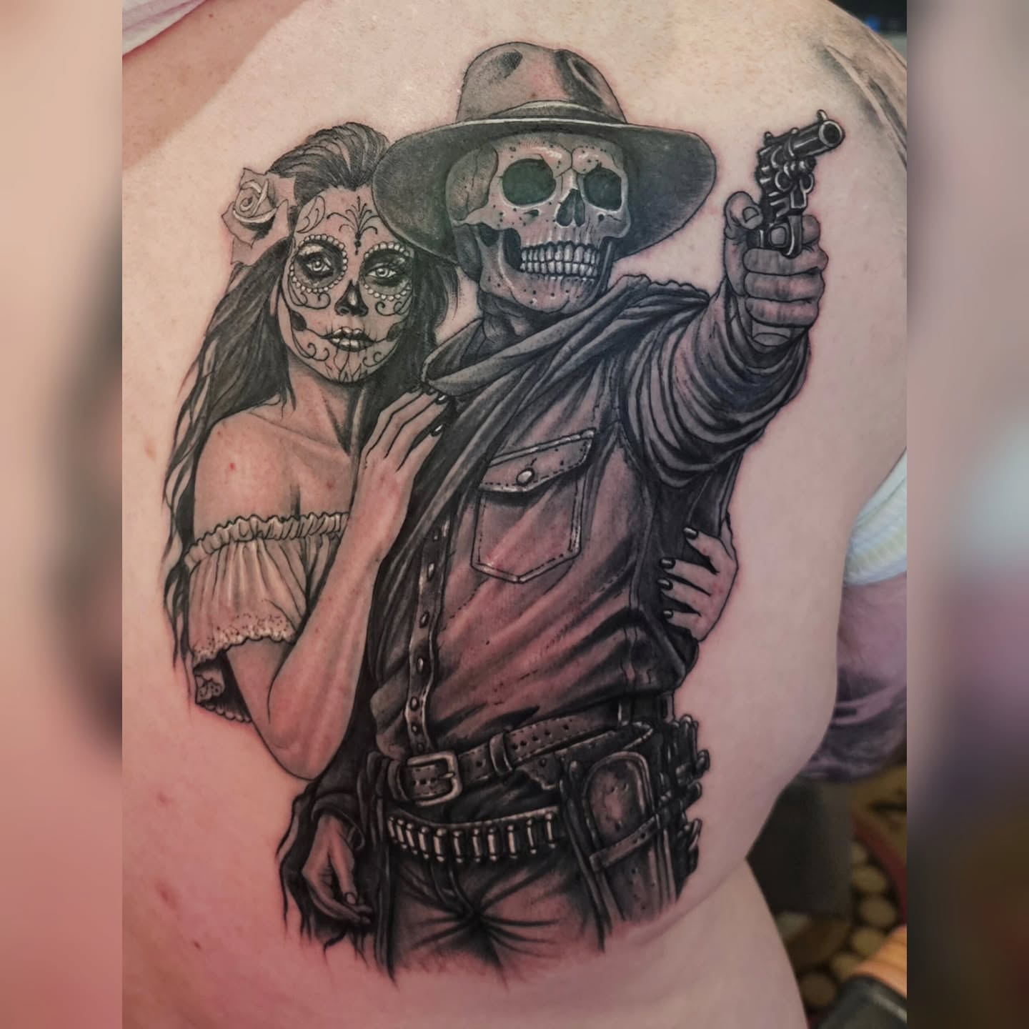 Cowboy and sugar skull woman realism tattoo on the shoulder by LMT Custom Ink - Leo Montanes Tattoos