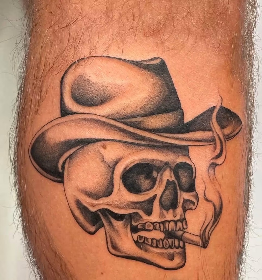 Skull wearing hat realism tattoo on the forearm by JAmy Winters