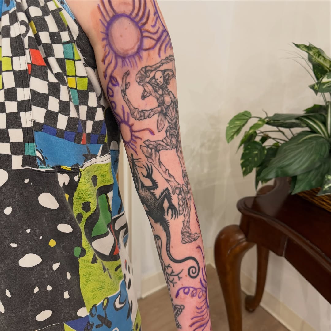 Mythical creature and sun neo-traditional tattoo on the forearm by Gus Roach Graves