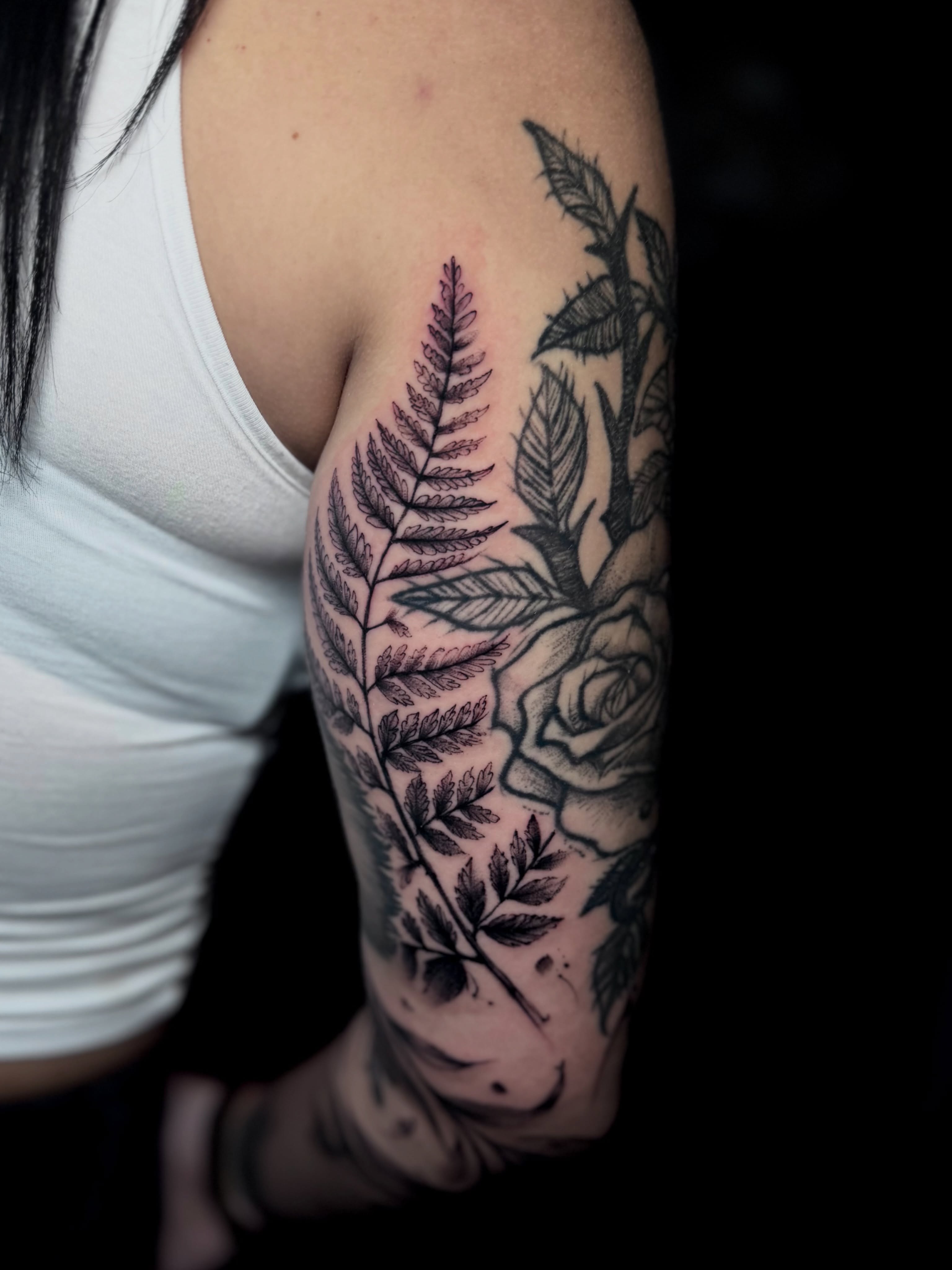 Fern and rose realism tattoo on the forearm by Keyla Valdes, Miami, Florida