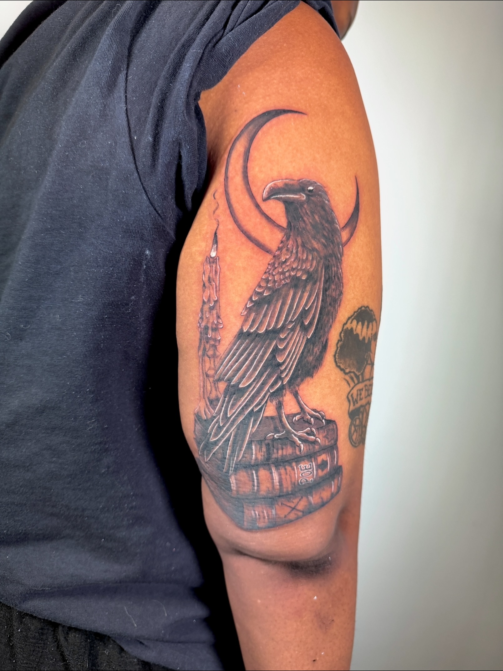 Crow and moon realism tattoo on the upper arm by aria, Austin, Texas