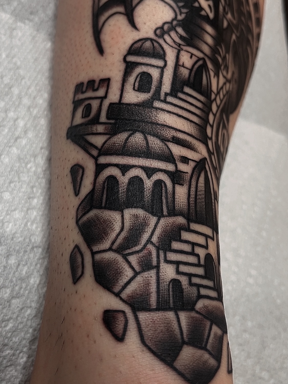 Castle black and grey tattoo on the forearm by Las Vegas Tattoo Artist