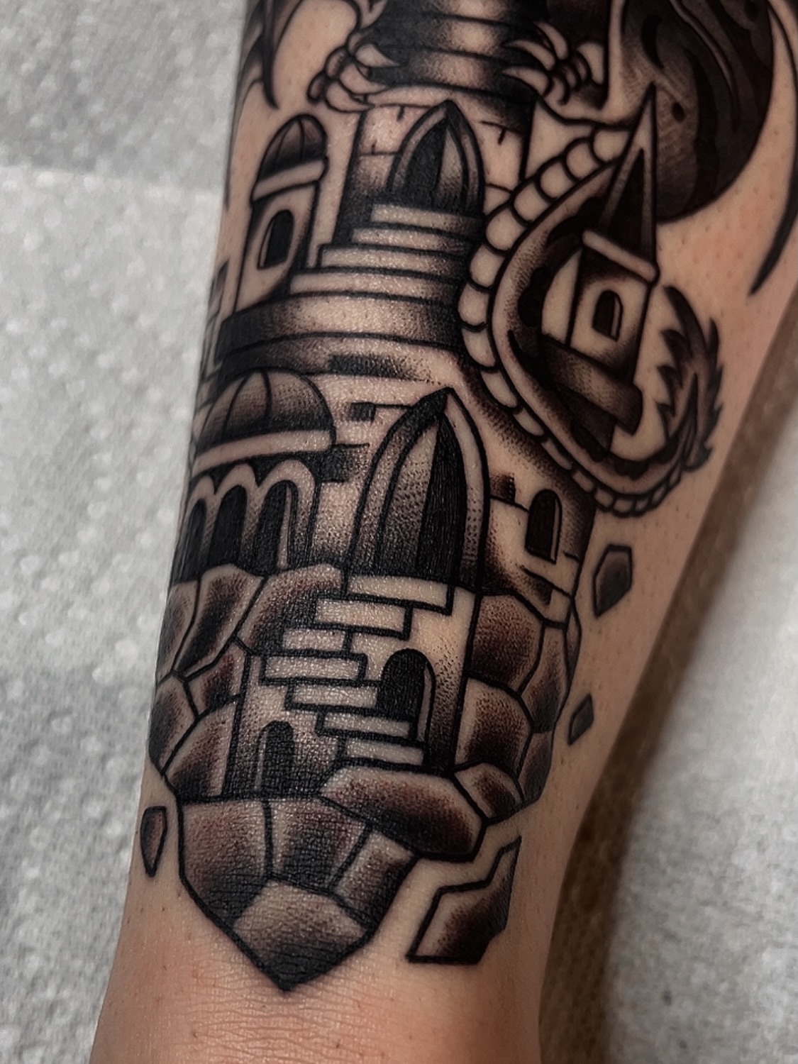 Castle black and grey tattoo on the forearm by Las Vegas Tattoo Artist