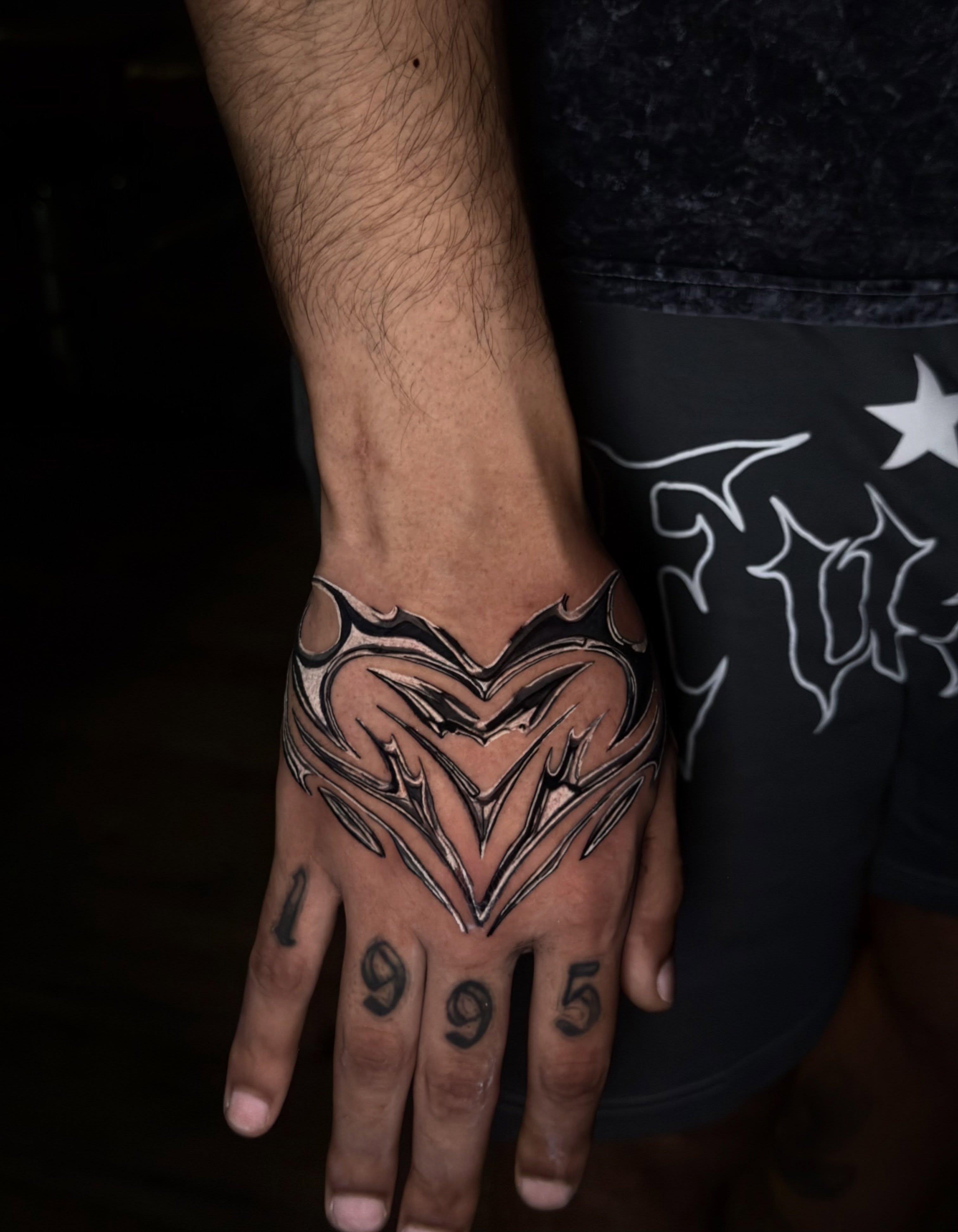Heart tribal tattoo on the hand by Giovanni Rodriguez, Eastpointe, Michigan