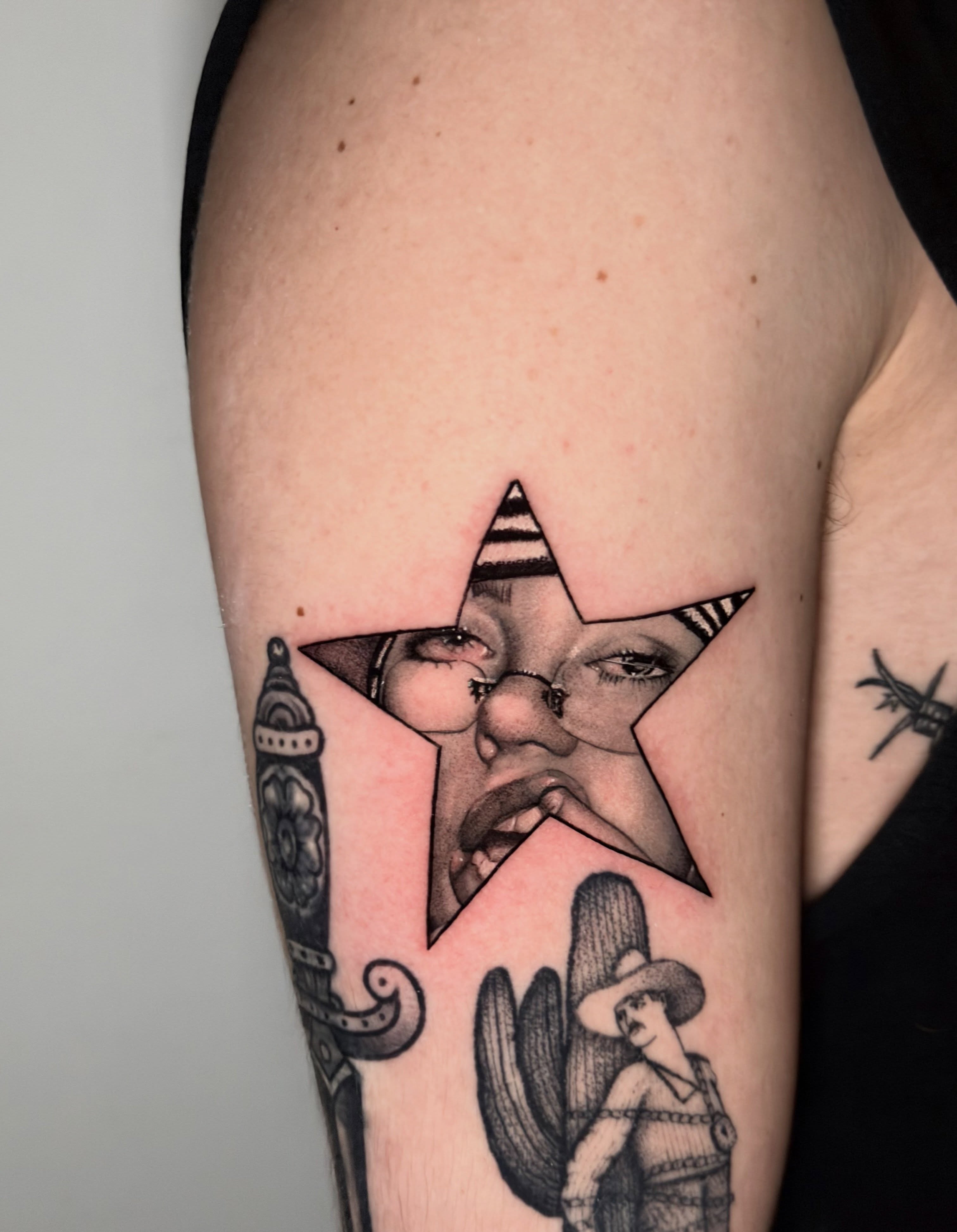 Star with woman's face realism tattoo on the forearm by Giovanni Rodriguez, Eastpointe, Michigan