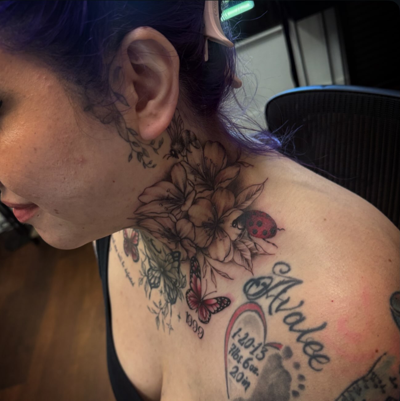 Flowers and ladybug black and grey tattoo on the neck by Sad Girl Tattoos