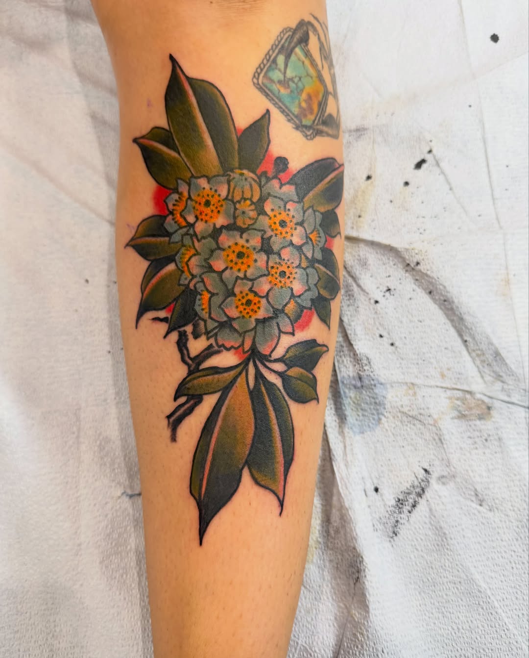 Flower bouquet American traditional tattoo on the forearm by Brian DiCola Tattooer