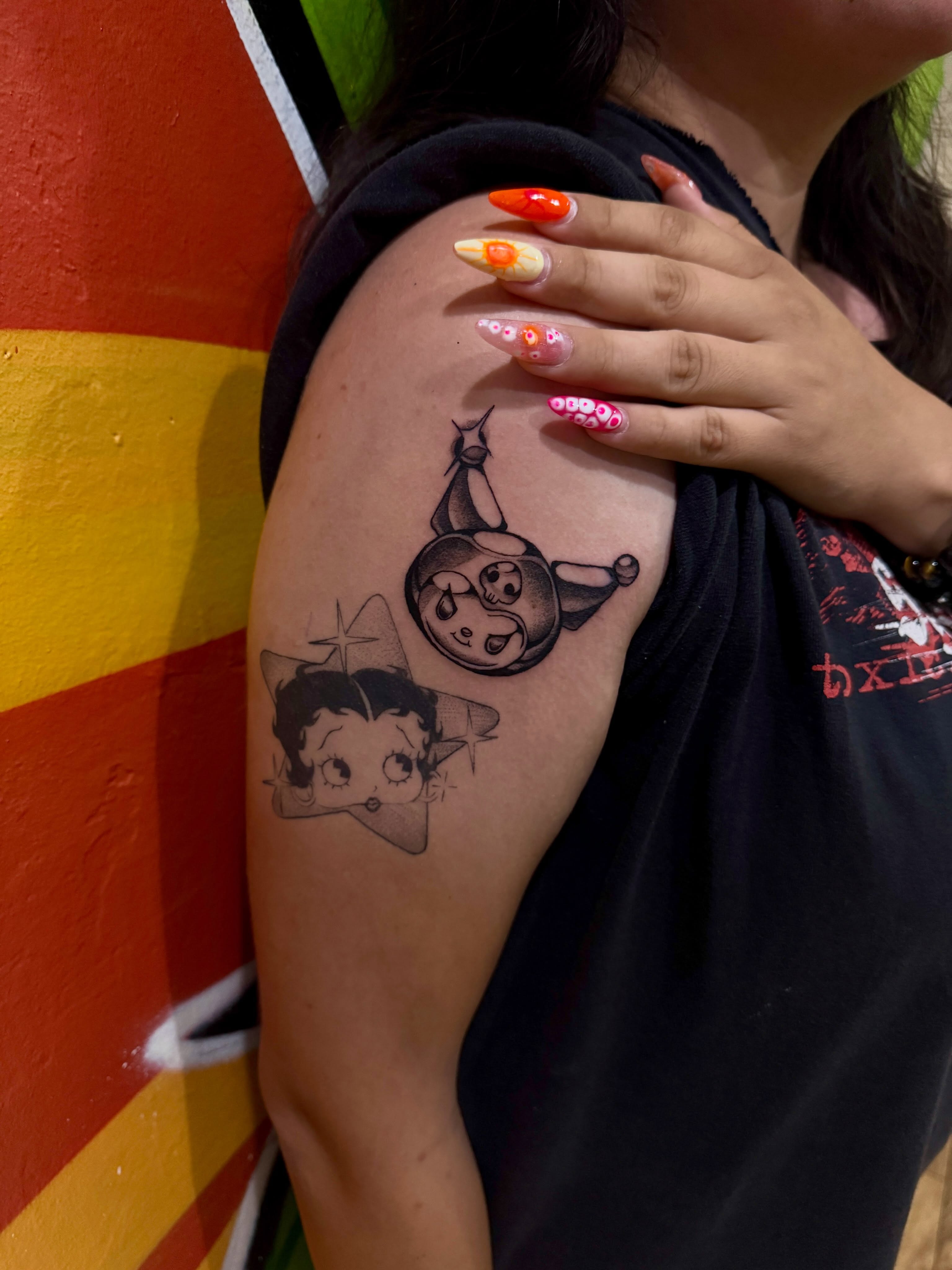 Betty boop and oswald the lucky rabbit black and grey tattoo on the shoulder by Stephy, Minneapolis, Minnesota