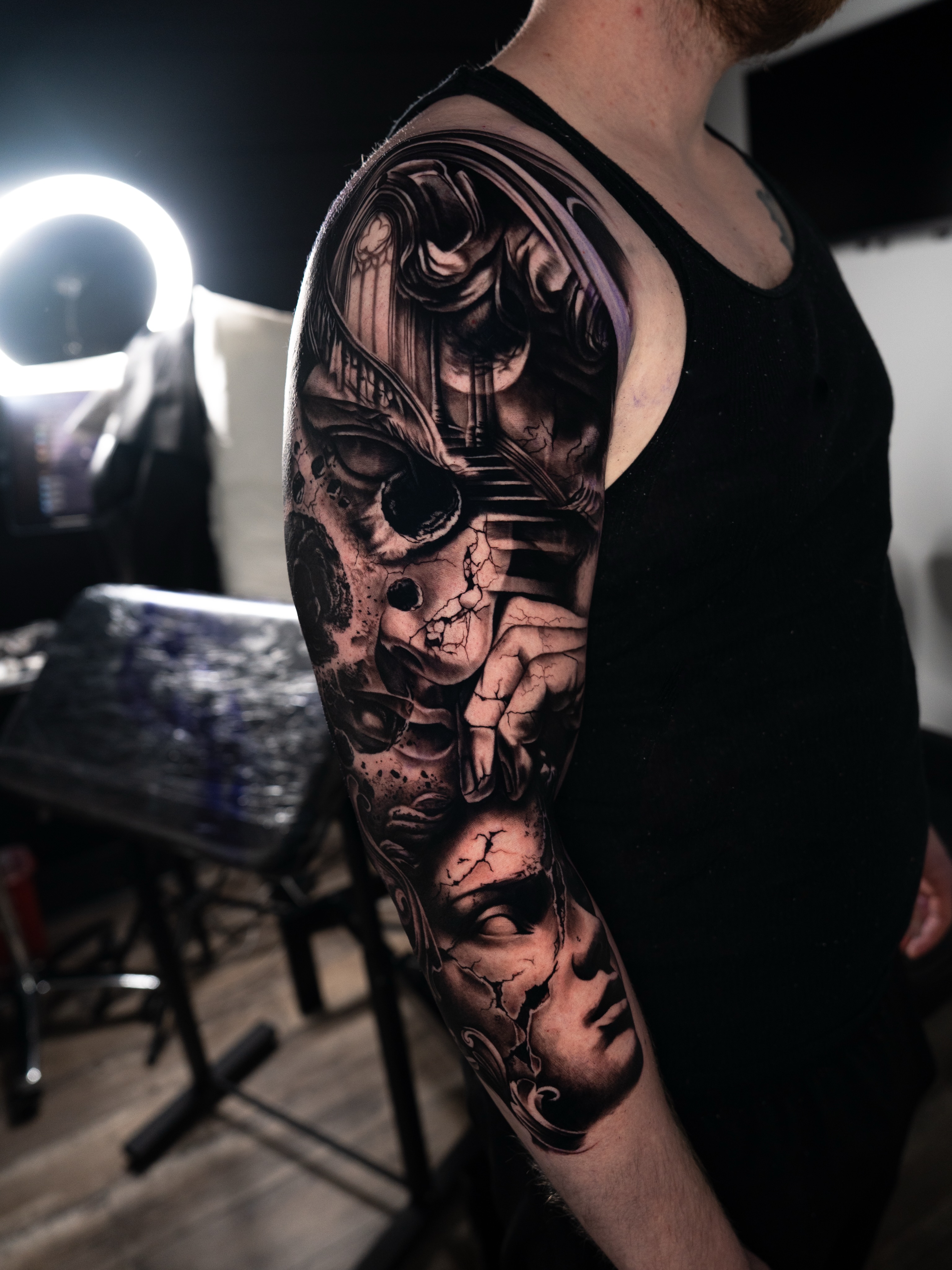 Tattoo by @mckenna_tattoo — dark_realism, black_and_grey