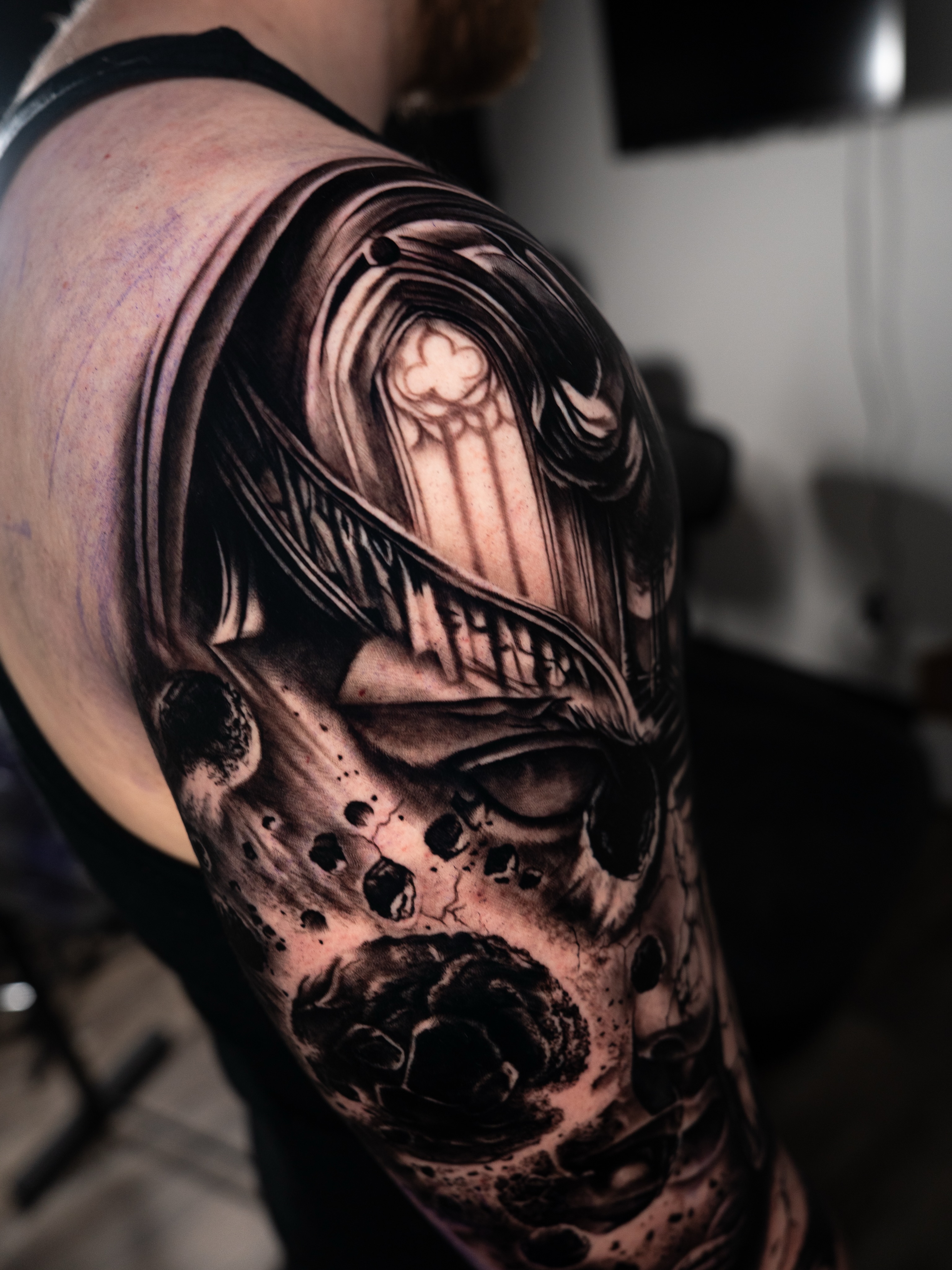 Tattoo by @mckenna_tattoo — dark_realism, black_and_grey