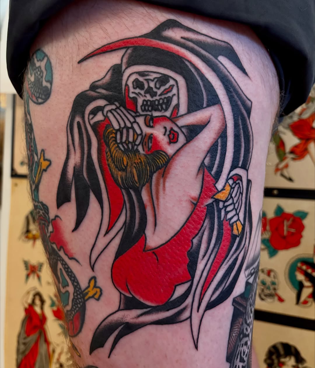 Death and woman American traditional tattoo on the thigh by Shane Coslett