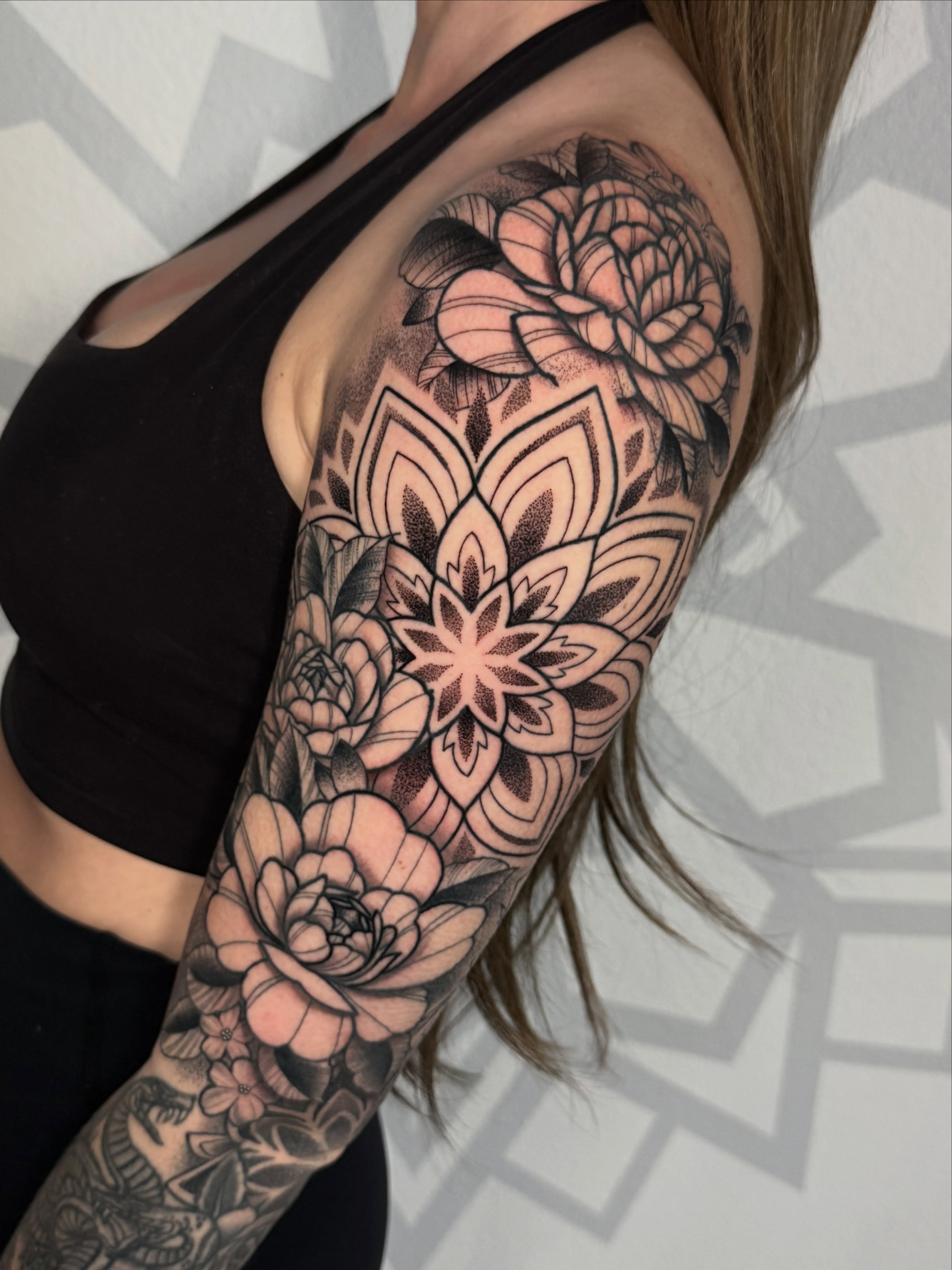 Floral mandala geometric tattoo on the upper arm by Las Vegas Tattoo Artist, Las Vegas, Nevada