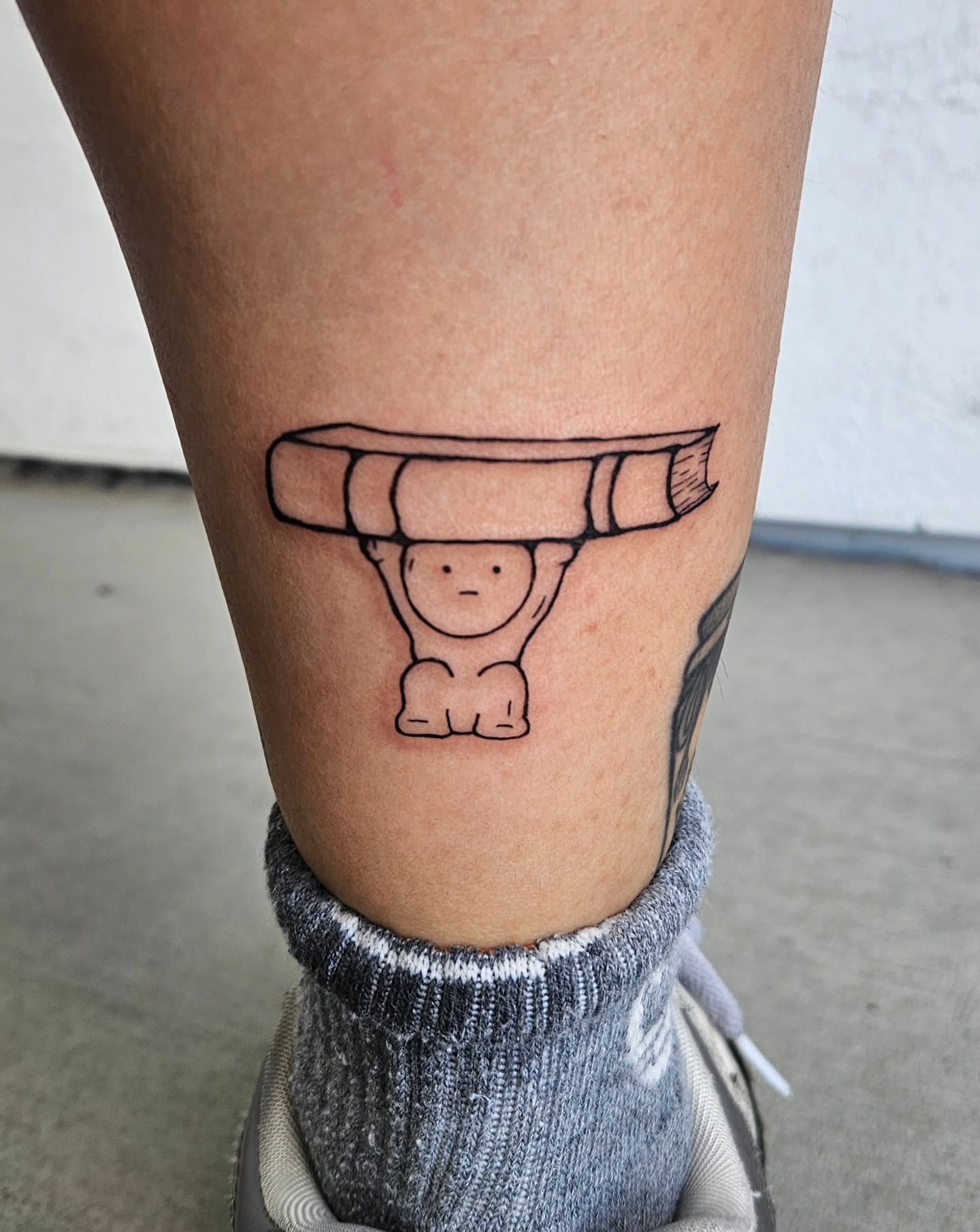 Bookworm minimalist tattoo on the calf by Lina ๐ป