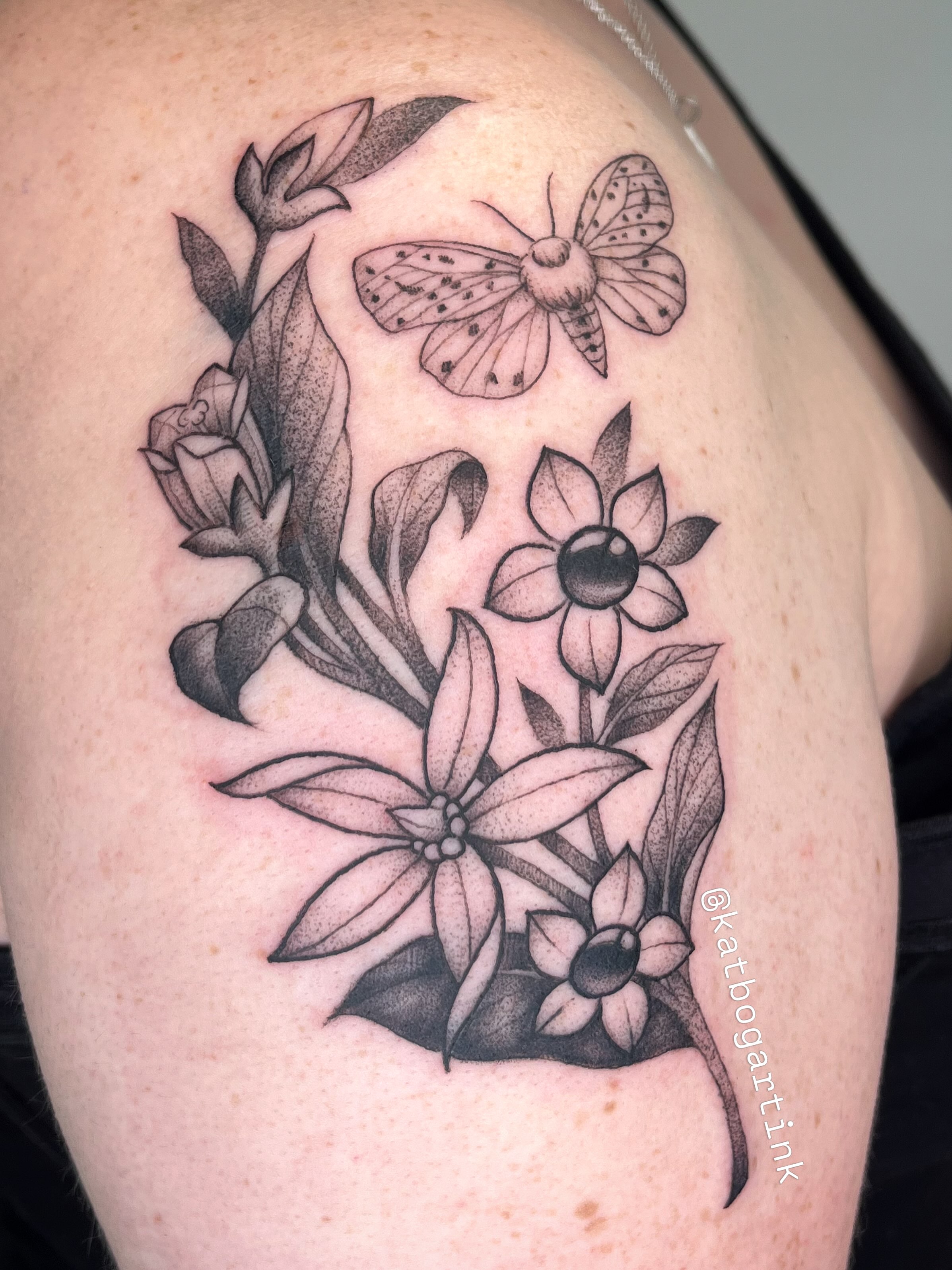 Butterfly and flowers black and grey tattoo on the shoulder by Kat (Scout) Bogart