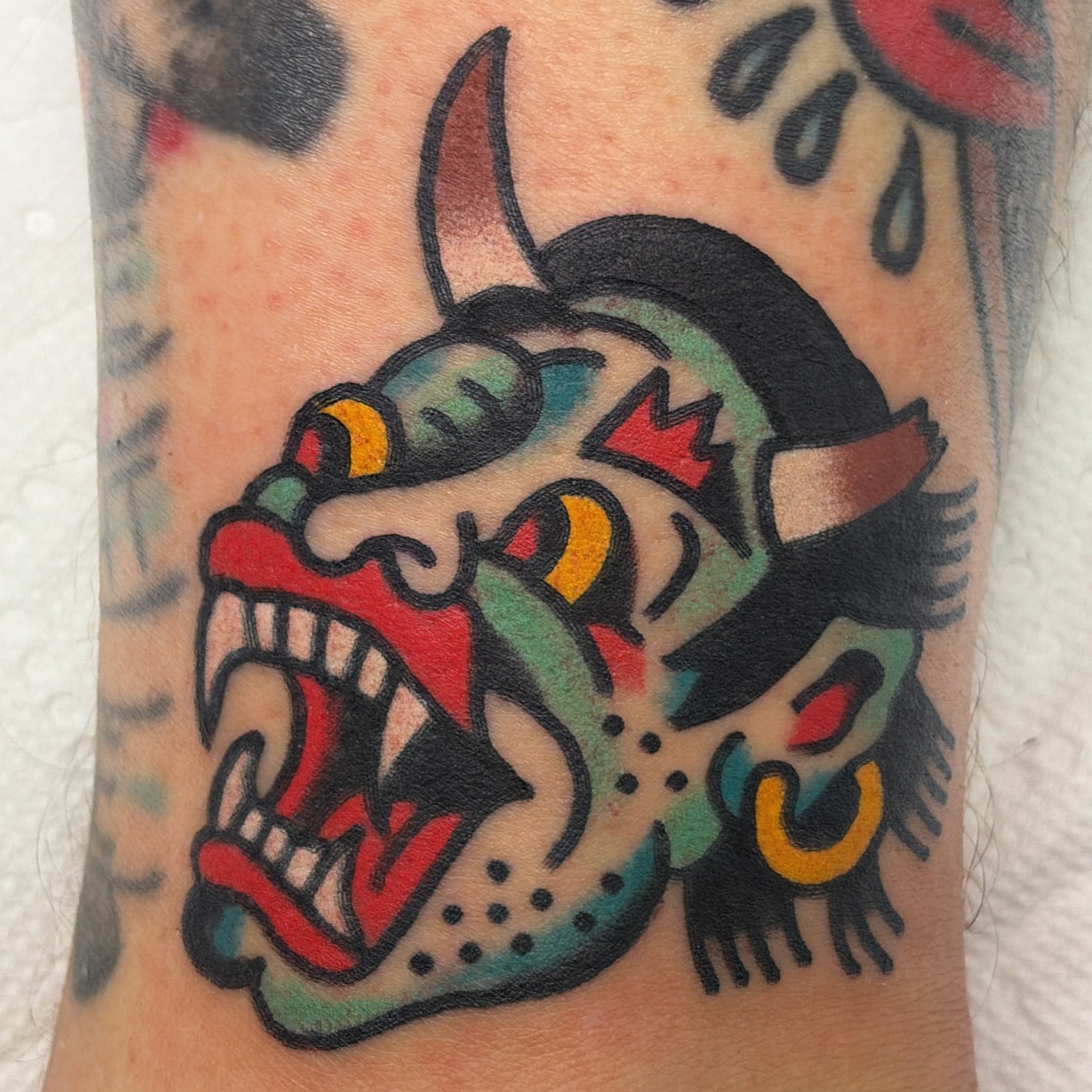 Demon head American traditional tattoo on the forearm by Isaac Brethauer