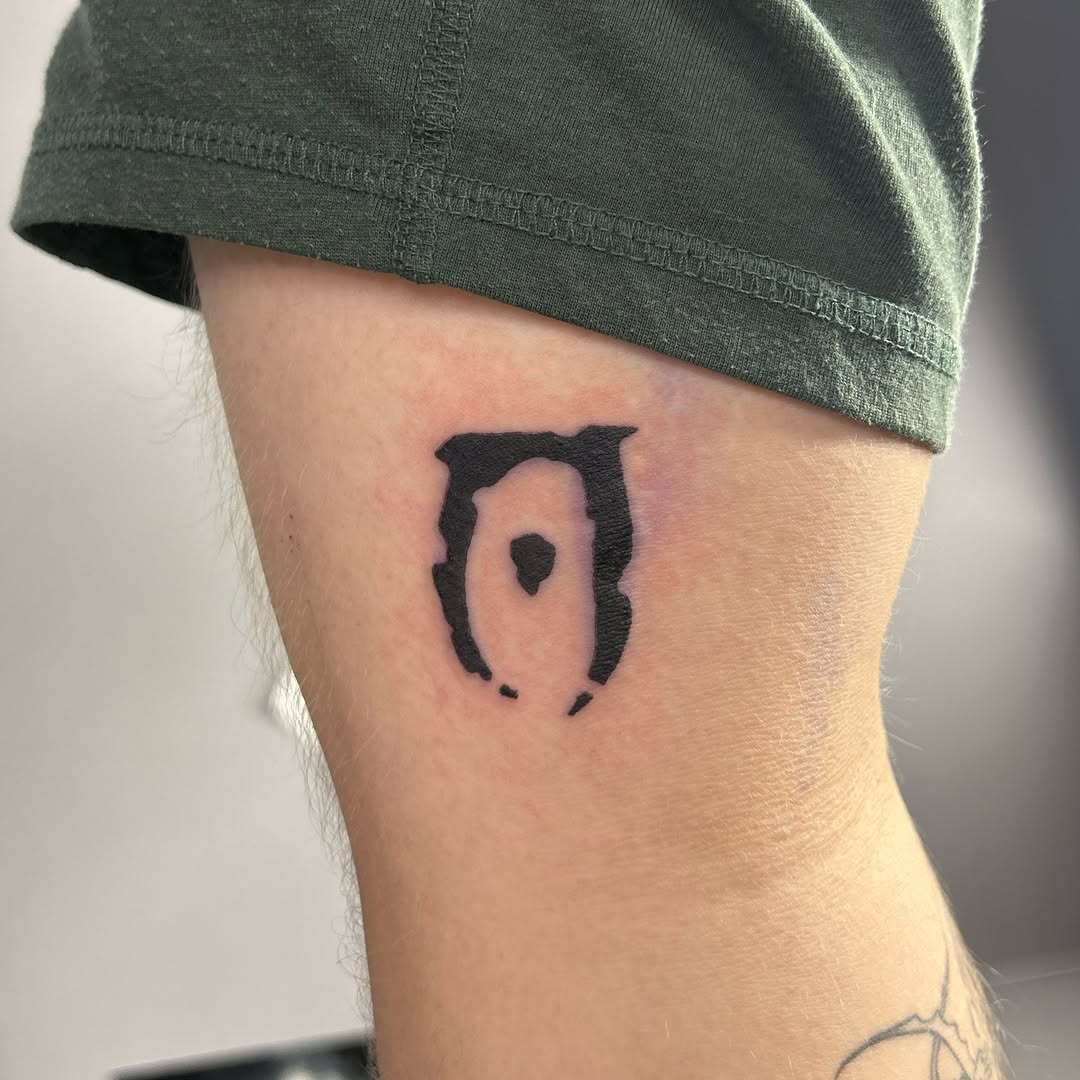 Ancient symbol black and grey tattoo on the forearm by Natalie Johnson, Minneapolis, Minnesota