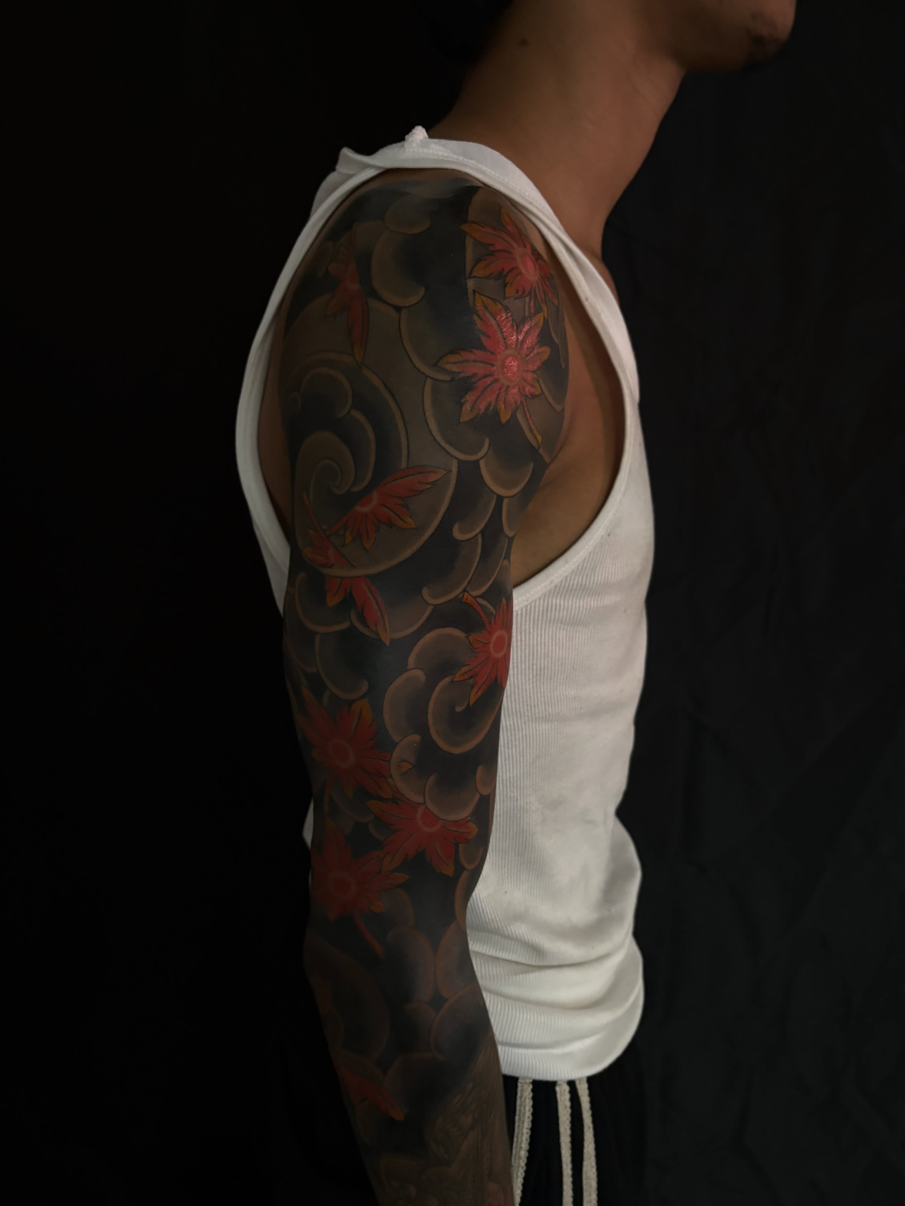 Floral design japanese irezumi tattoo on the upper arm by Zach Hendrickson