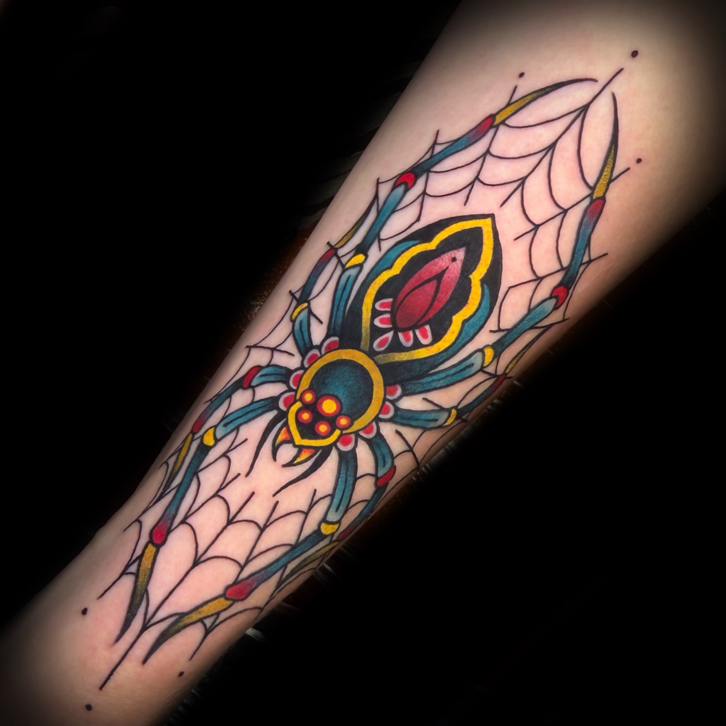 Spider web American traditional tattoo on the forearm by Kelsea Weir McCree