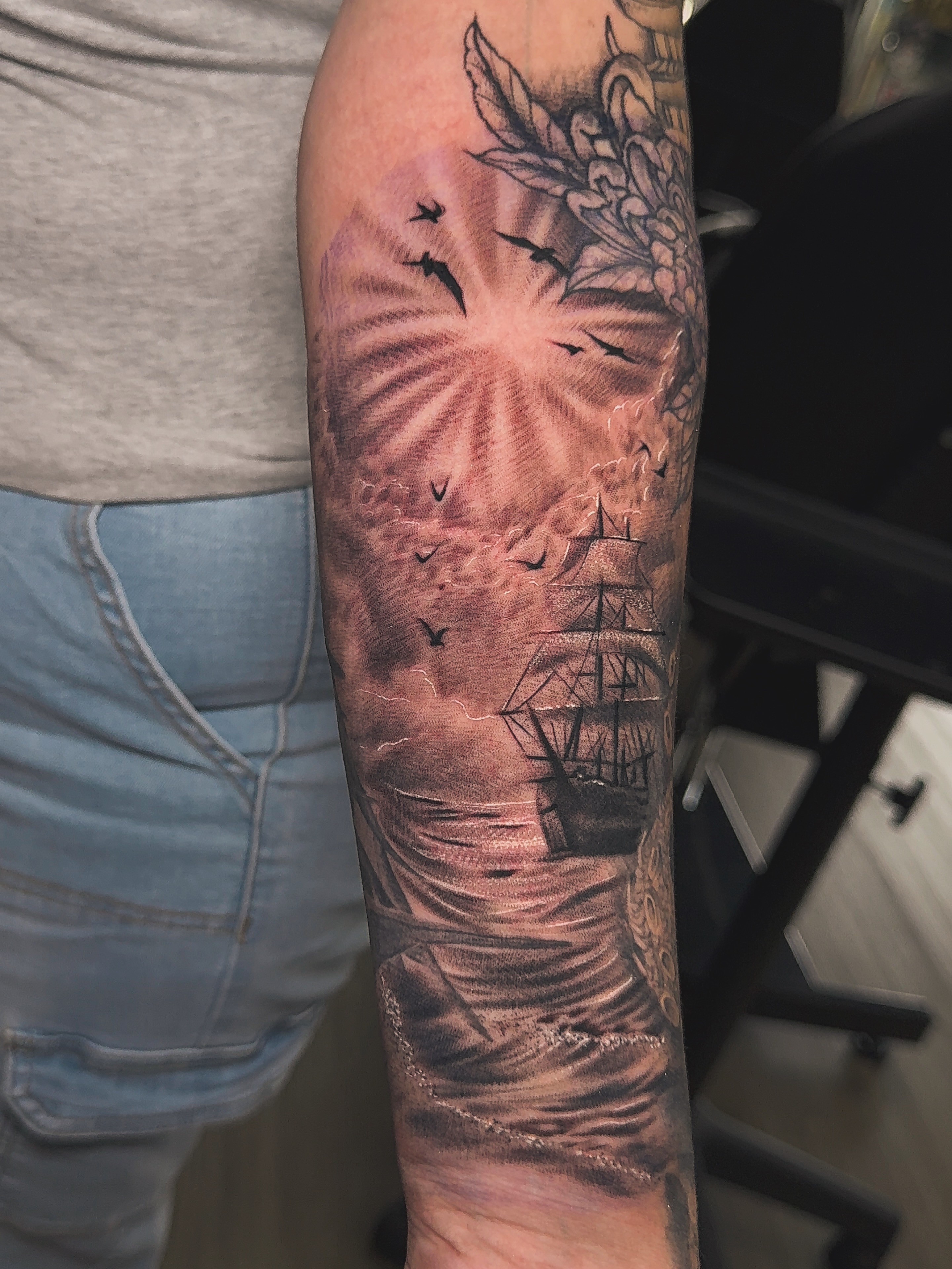Ship and birds realism tattoo on the forearm by Dallas tattoo artist, Dallas, Texas