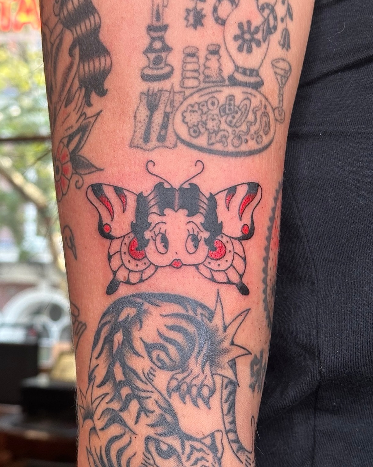 Betty Boop butterfly American traditional tattoo on the forearm by Sequoia Rose, Portland, Oregon