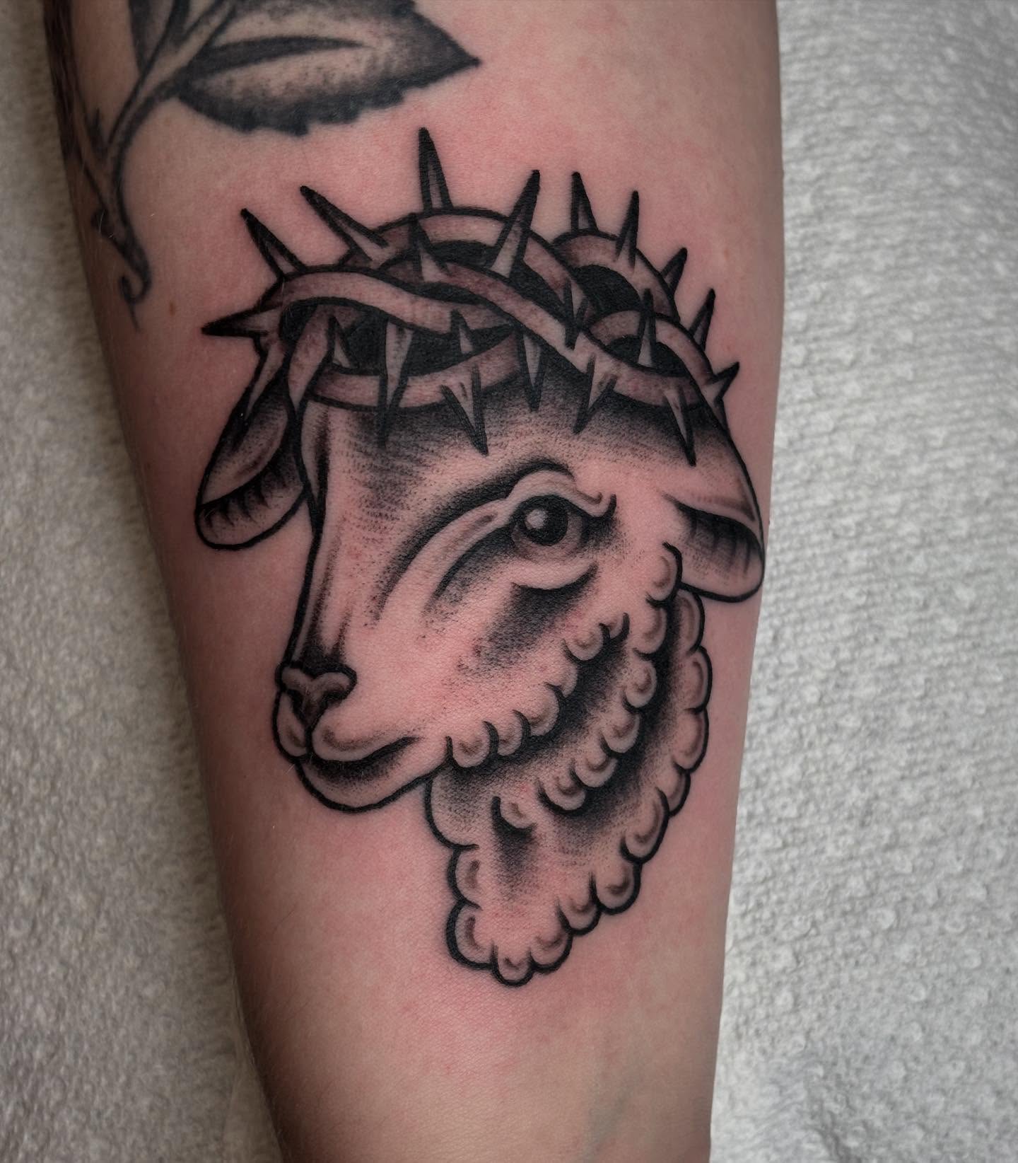 Sheep with crown of thorns black and grey tattoo on the forearm by Brandi ⛓, Detroit, Michigan