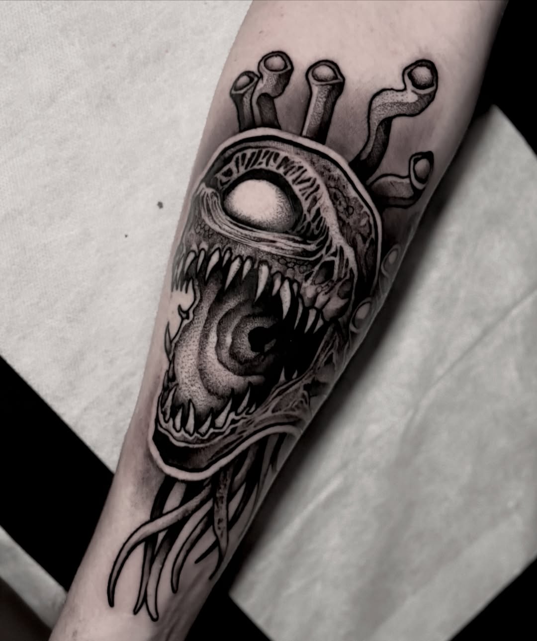 Alien head realism tattoo on the forearm by Clayton Smith (BEAR)