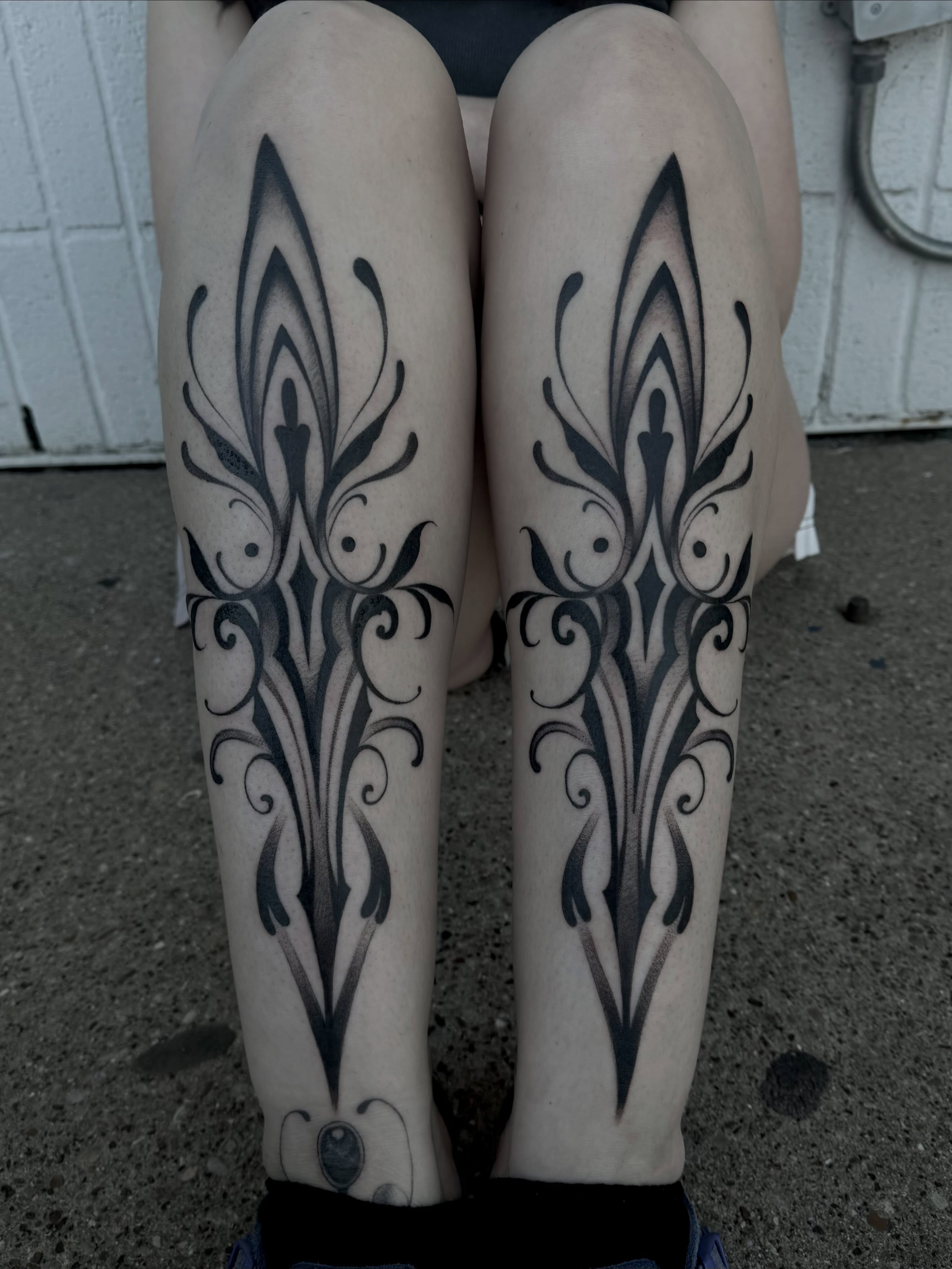 Floral pattern tribal tattoo on the calf by Claire Litsey