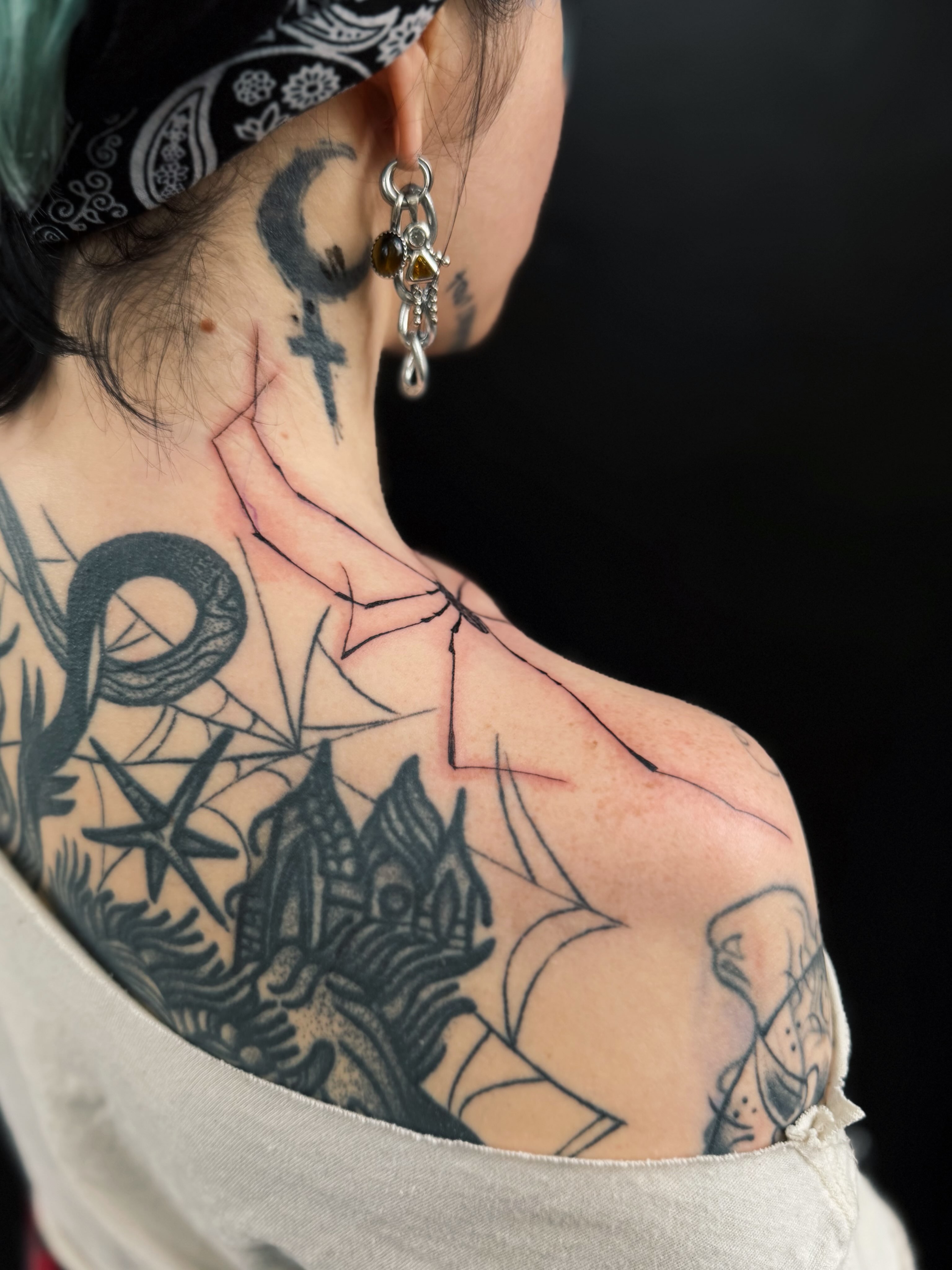 Snake and peony American traditional tattoo on the shoulder by @amandahowtattoo