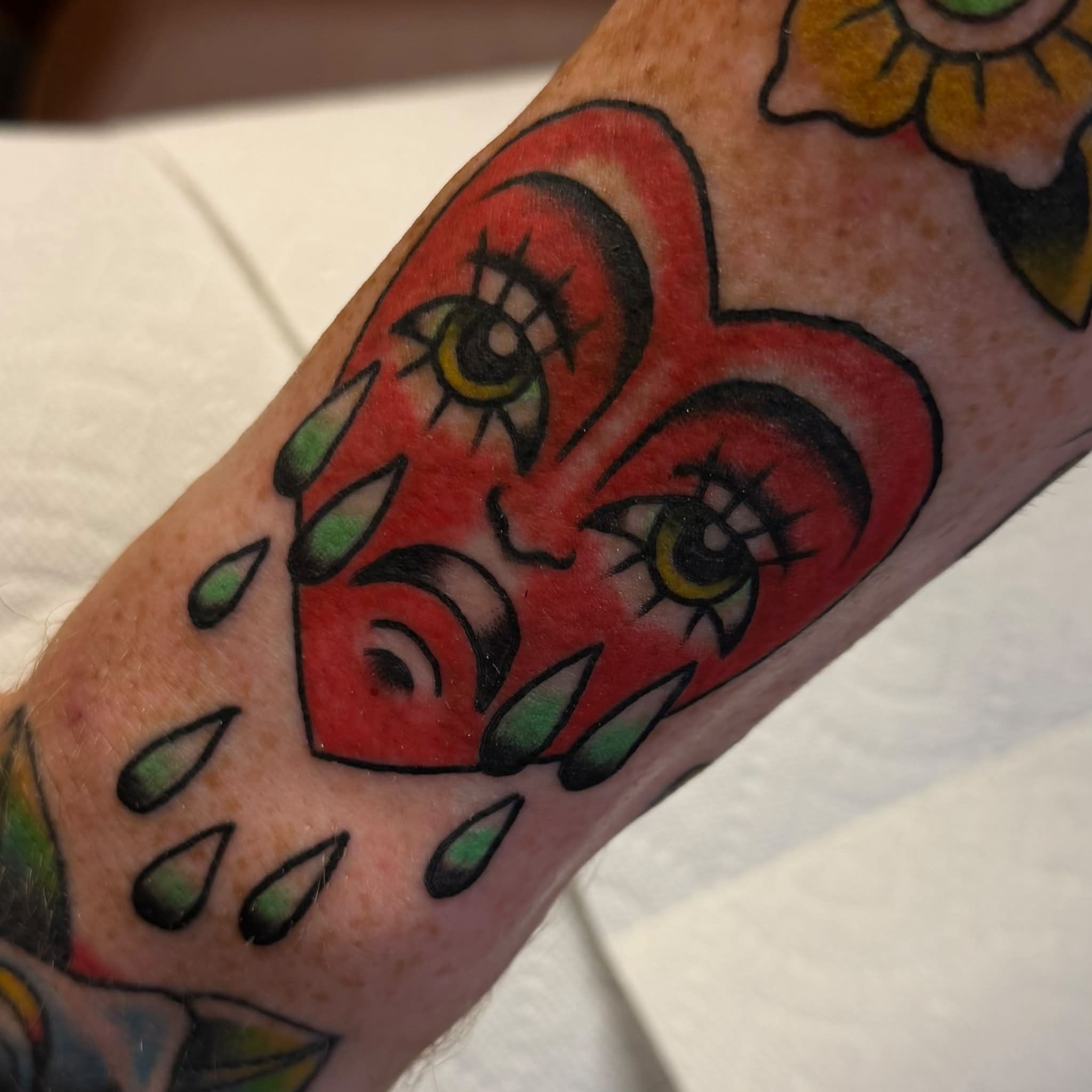 Fleur-de-lis American traditional tattoo on the forearm by Kenneth Prince