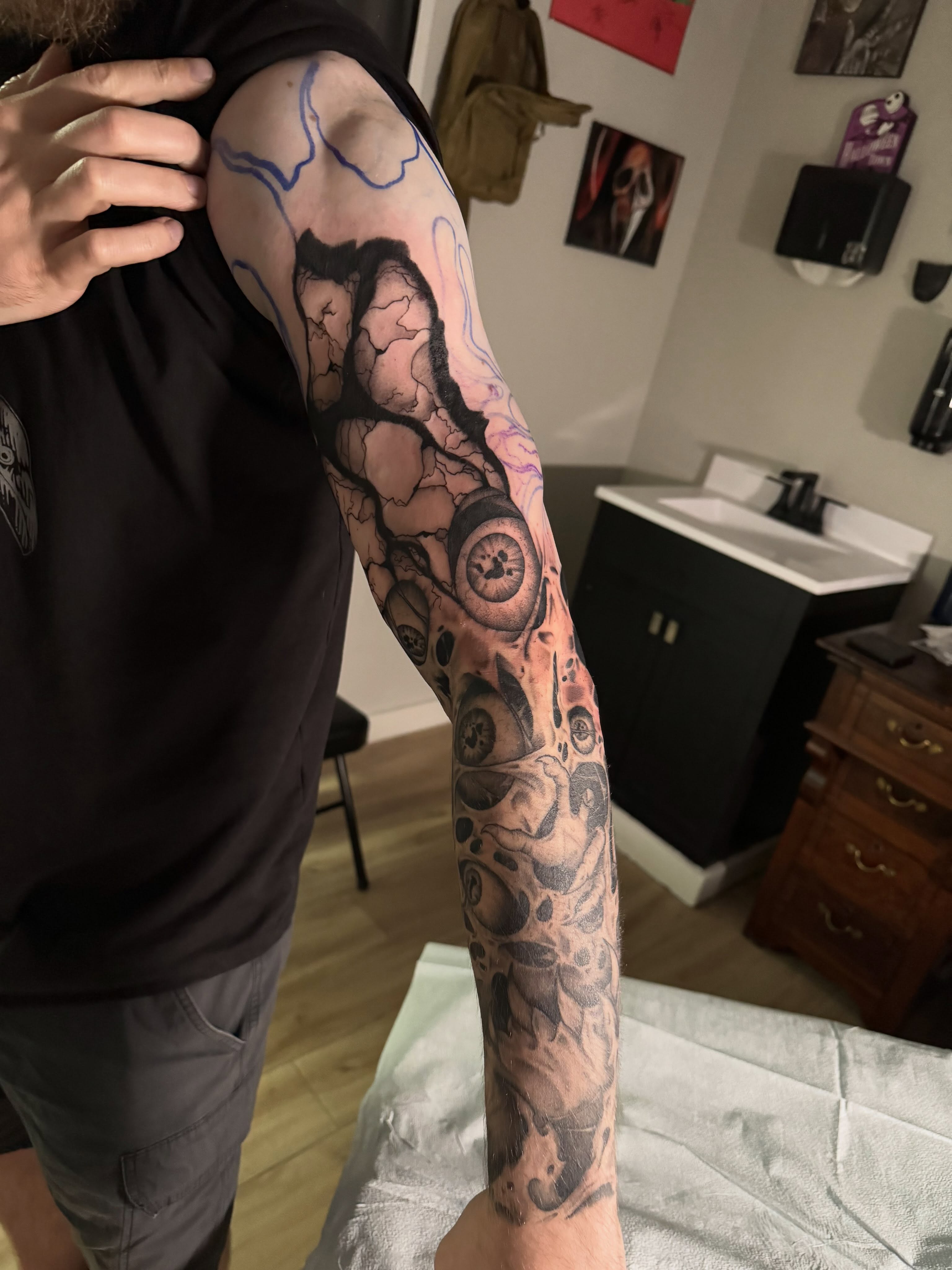 Abstract biomechanical surrealism tattoo on the forearm by Jon Fleming