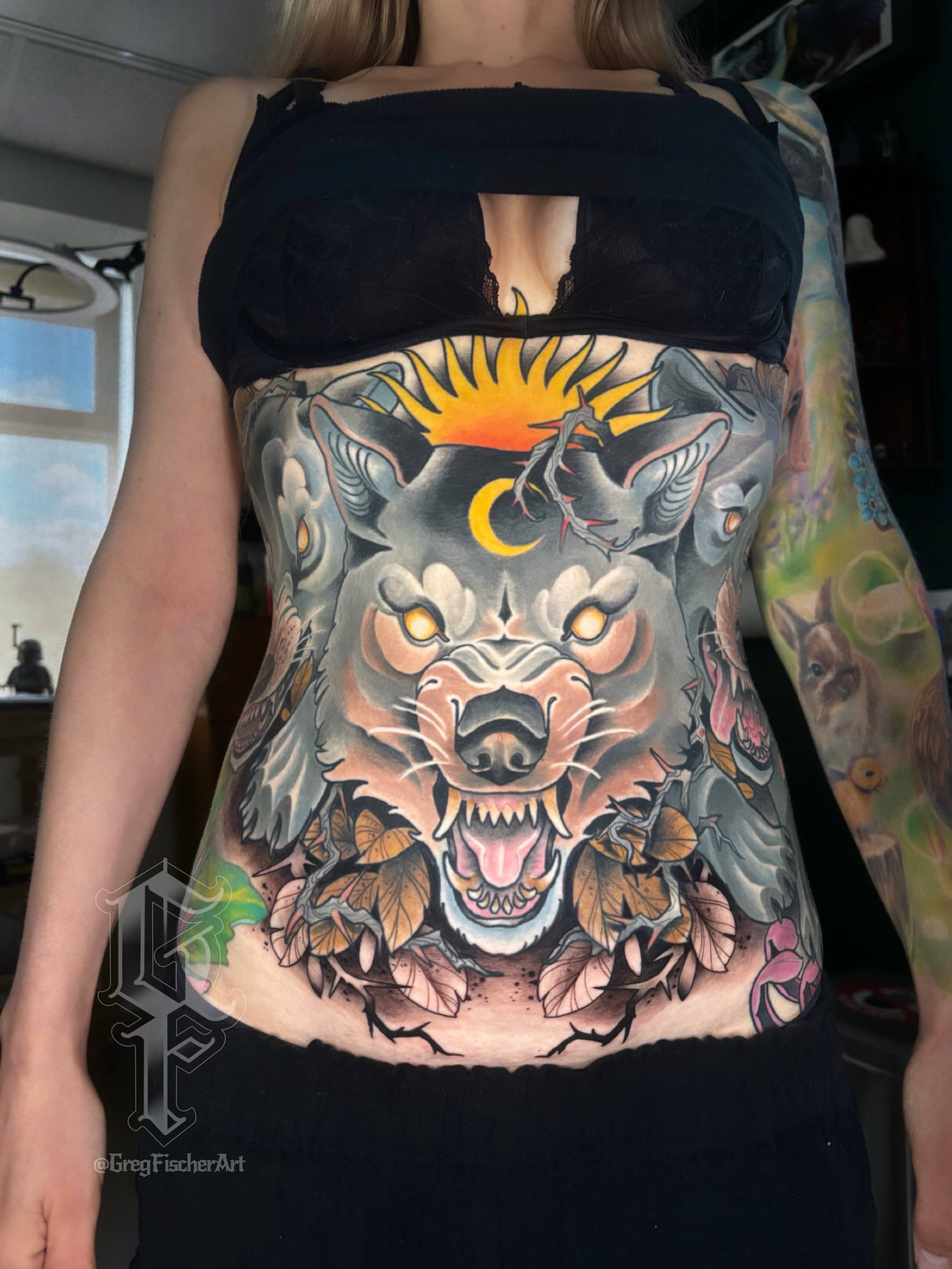 Wolf American traditional tattoo on the torso by Greg Fischer