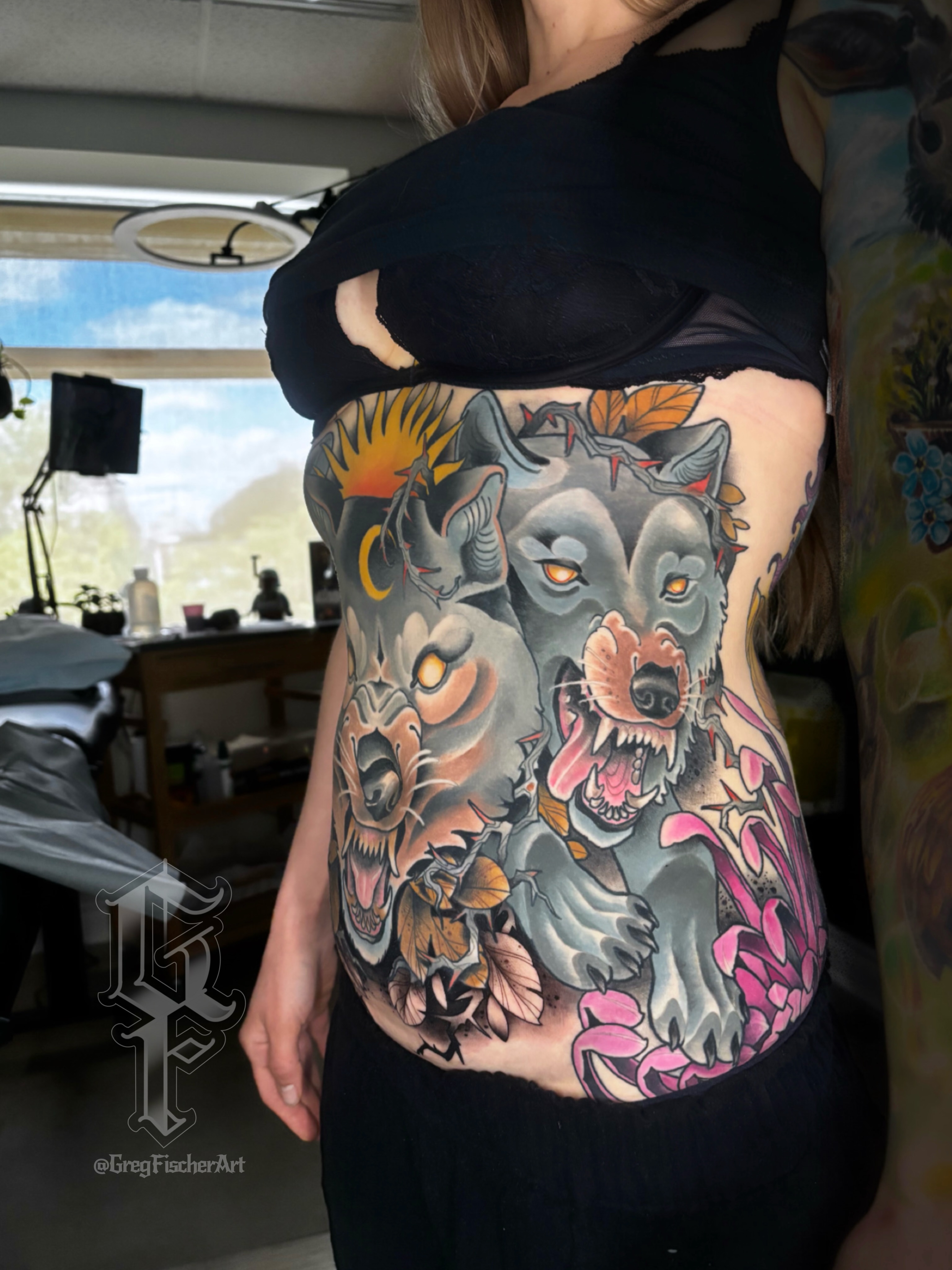 Wolf and bear American traditional tattoo on the torso by Greg Fischer