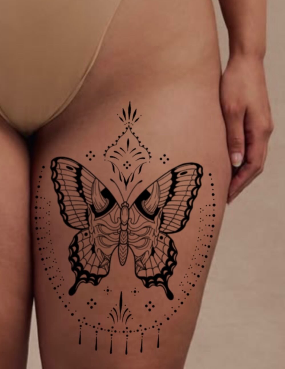 Butterfly dotwork tattoo on the thigh by Natalie