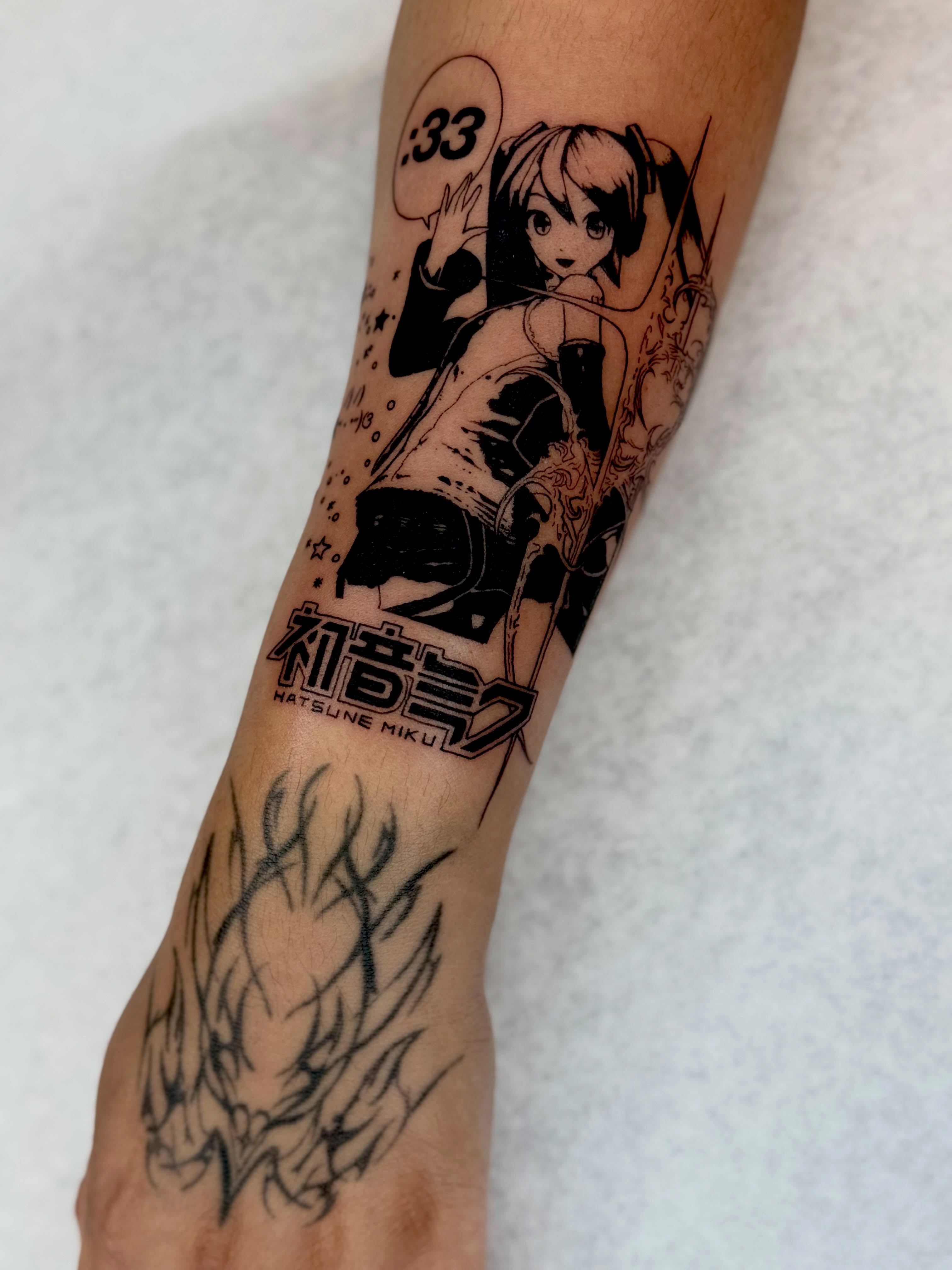 Hatsune Miku anime tattoo on the forearm by Em Krieg