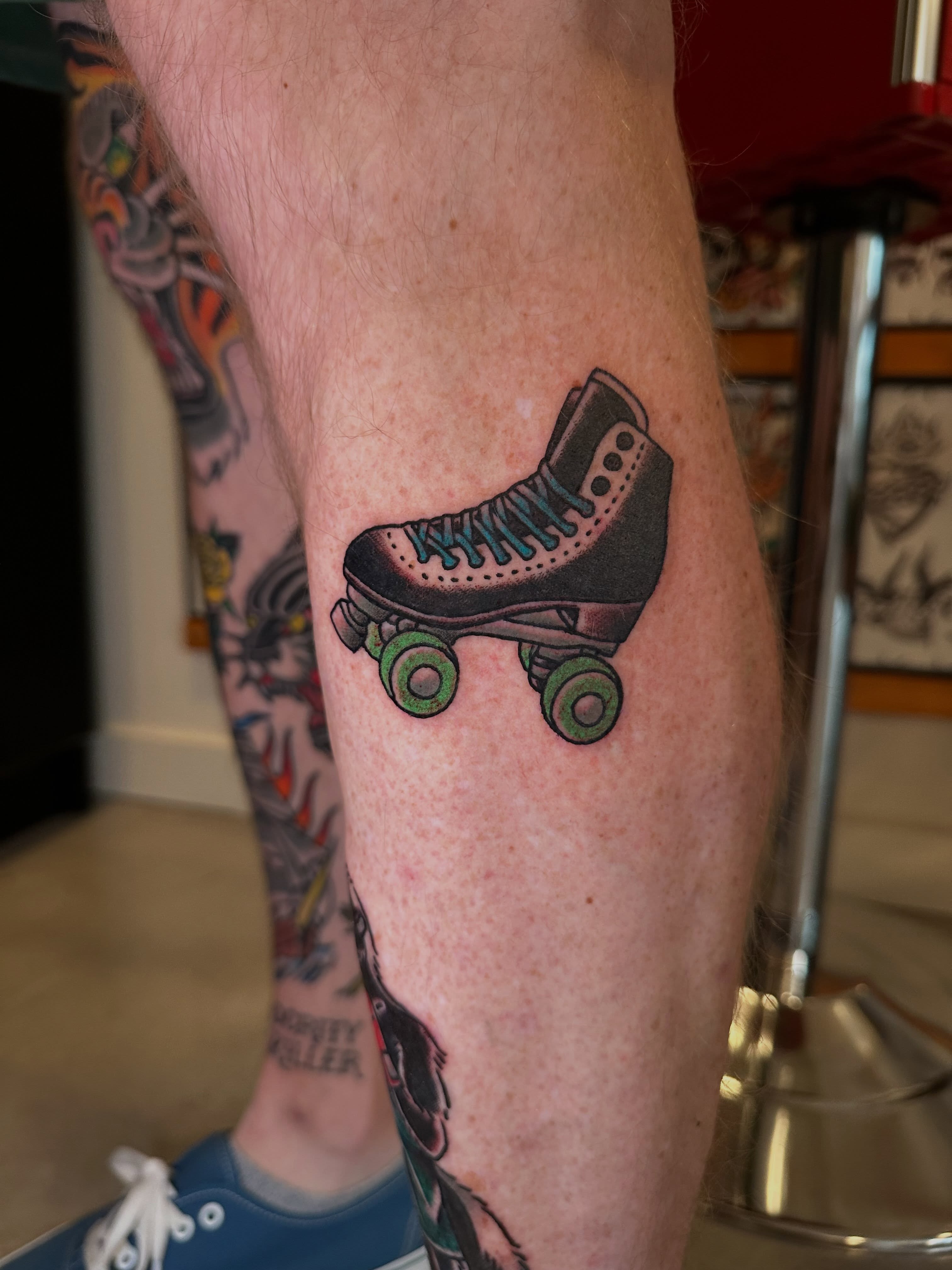 Roller skate American traditional tattoo on the calf by Whitney Creep Tattoos