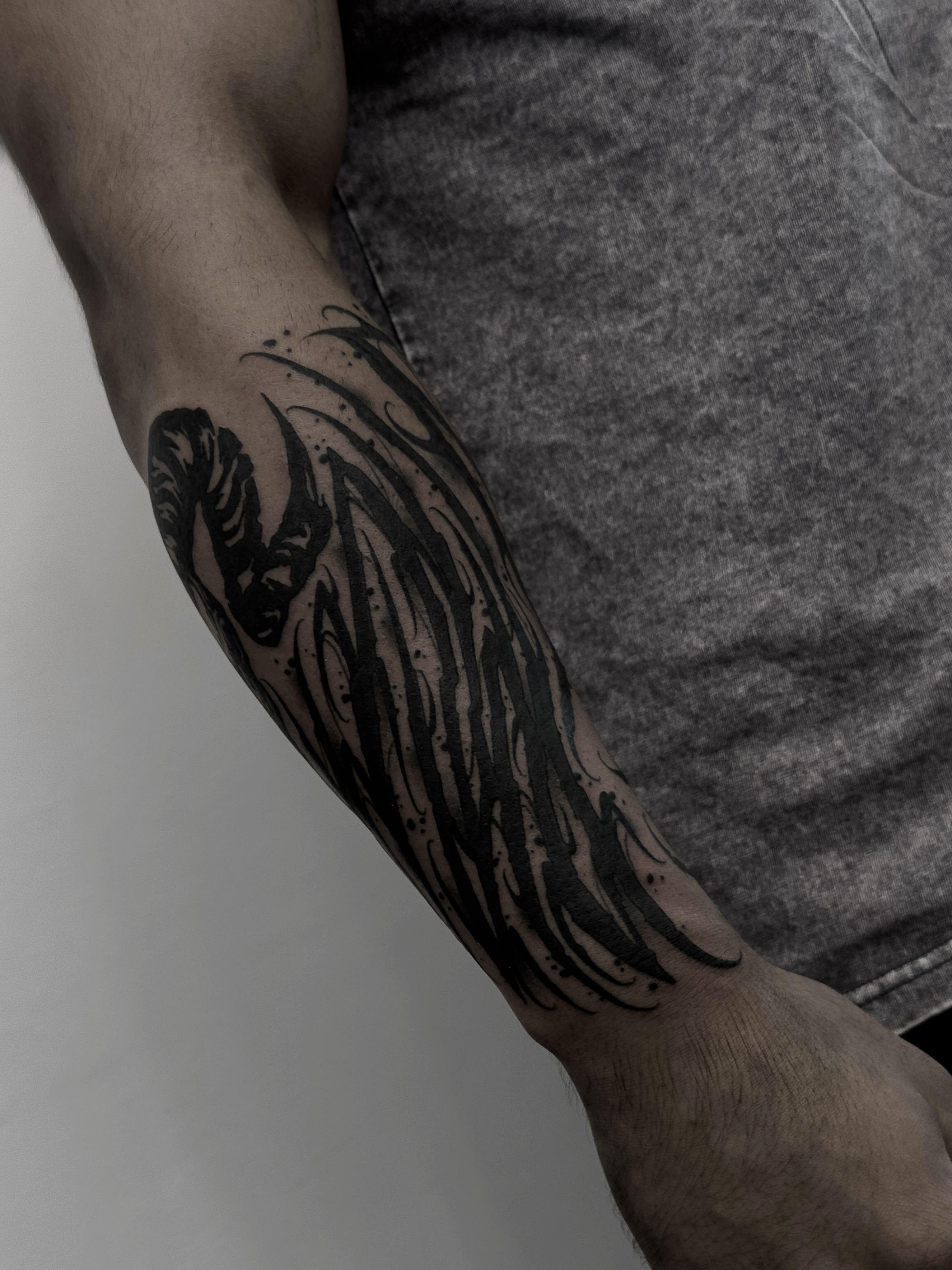 Winged creature black and grey tattoo on the forearm by ⚔️Andreas Dolleschal⚔️