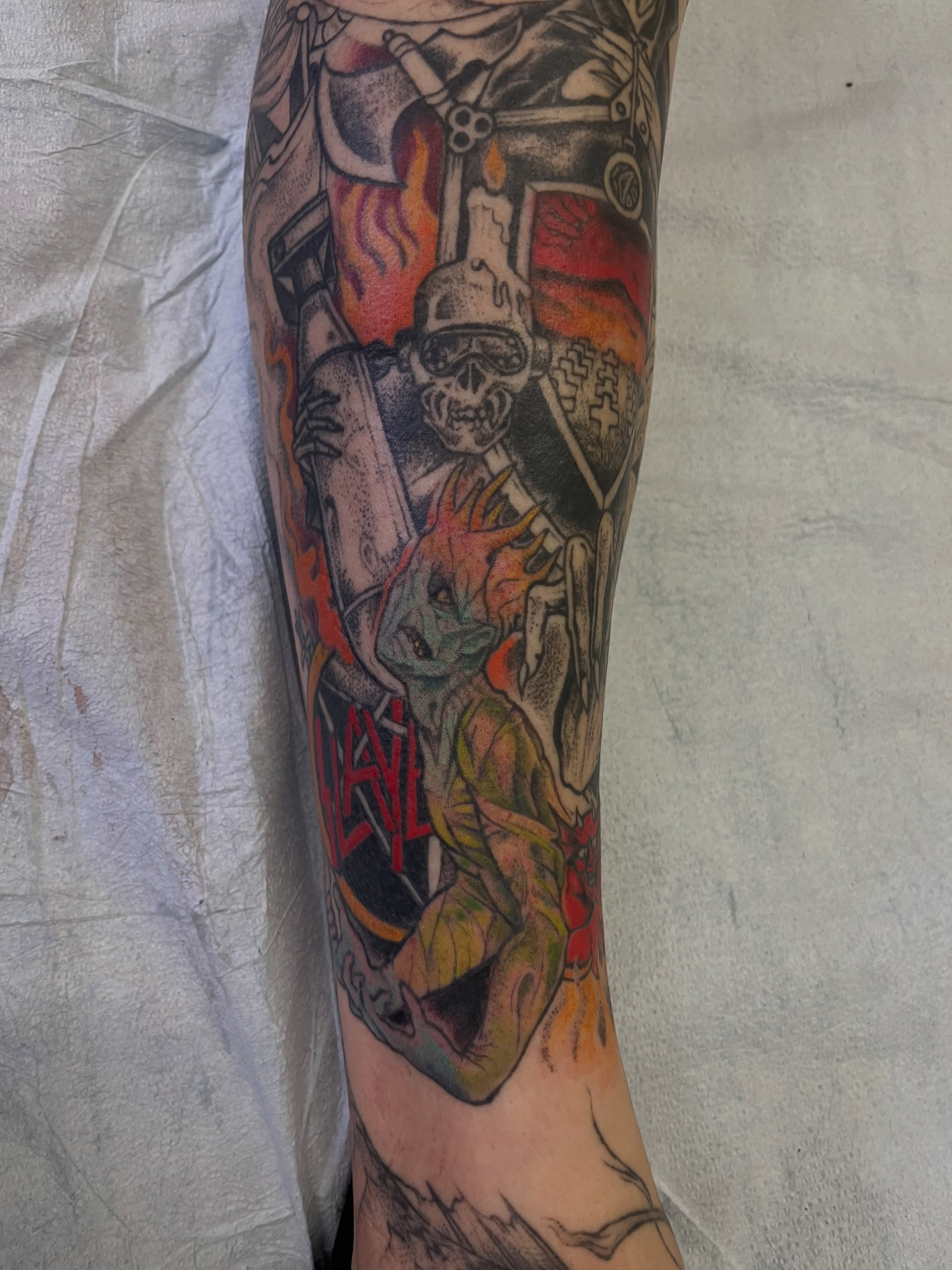 Skeleton and dragon American traditional tattoo on the forearm by Lacey B, Portland, Oregon
