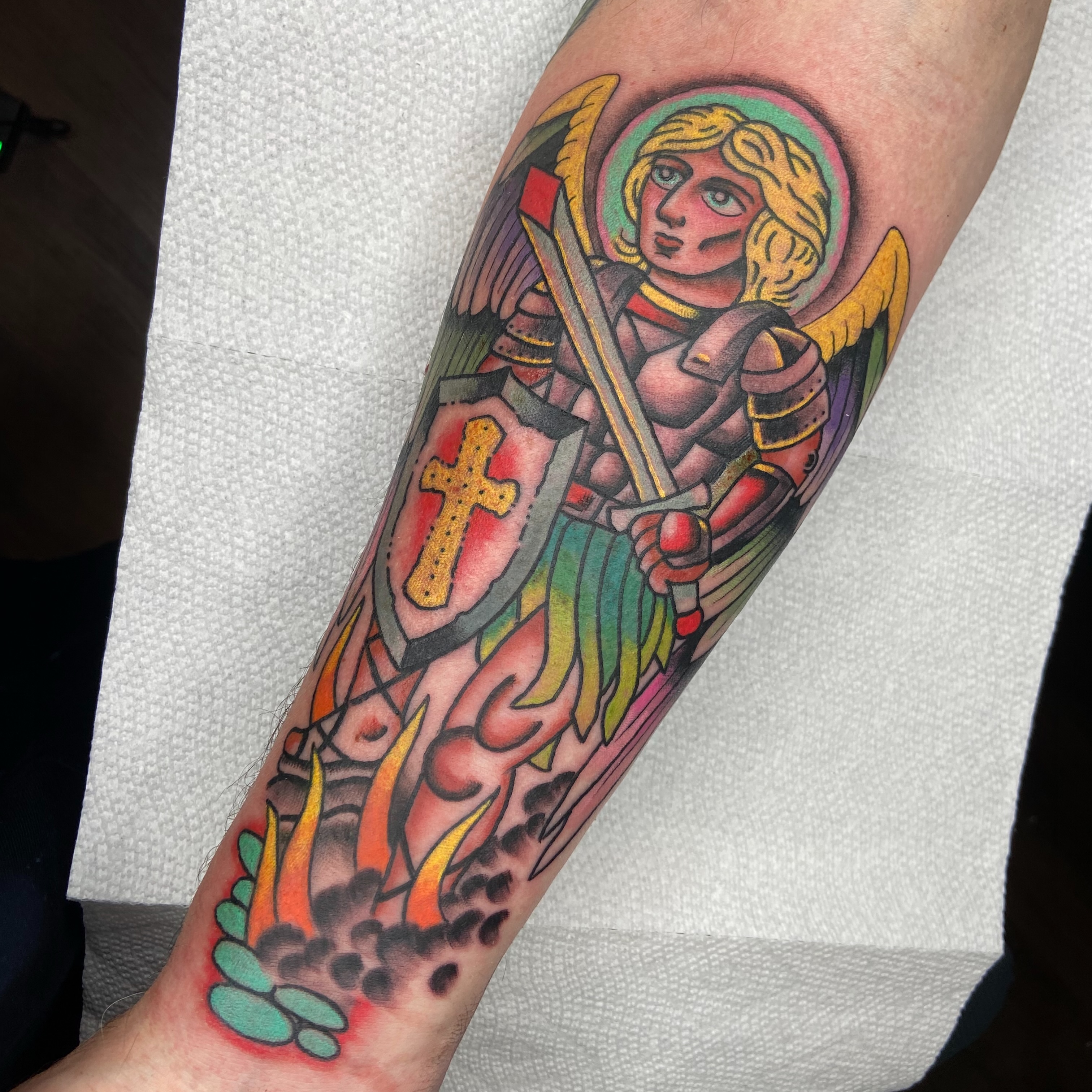 Saint with sword and shield American traditional tattoo on the forearm by nicholas mcevoy, Boston, Massachusetts