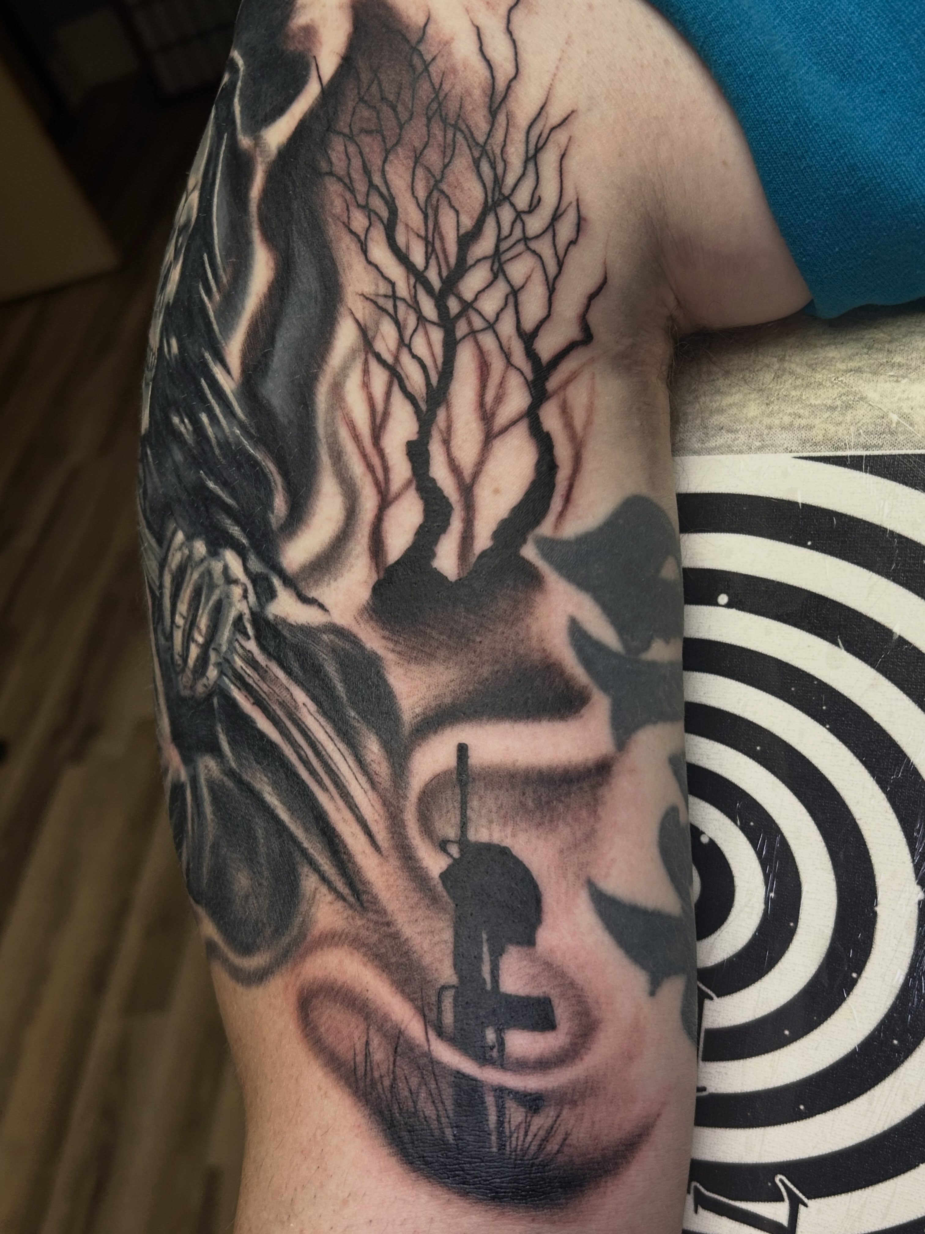 Forest silhouette realism tattoo on the forearm by Dan Schuster
