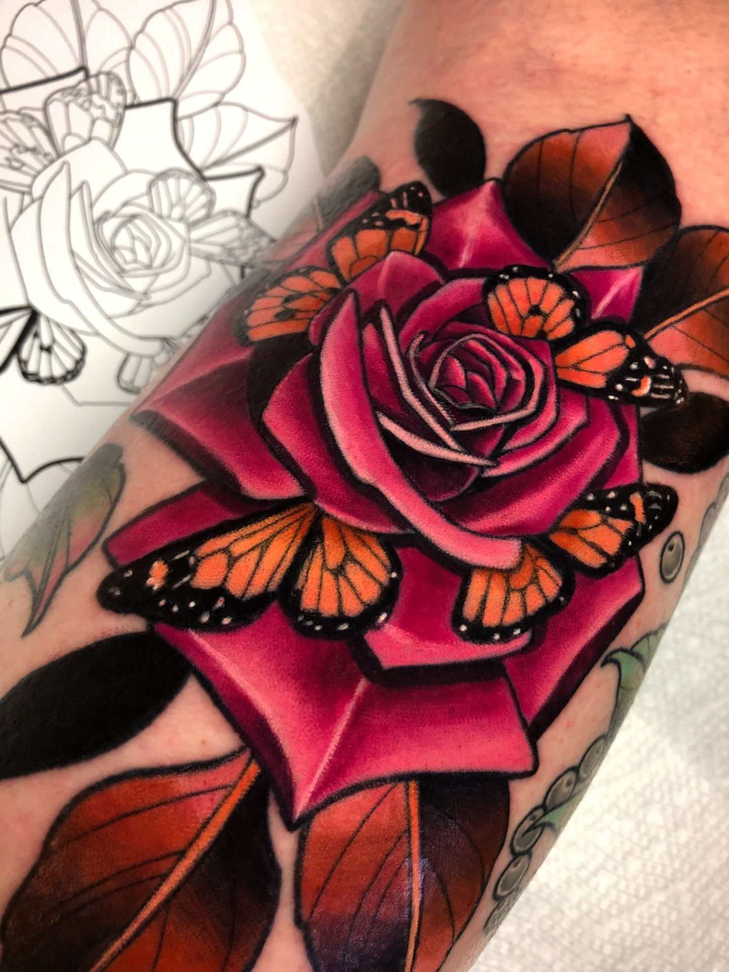 Rose and butterflies realism tattoo on the forearm by Melissa Brown