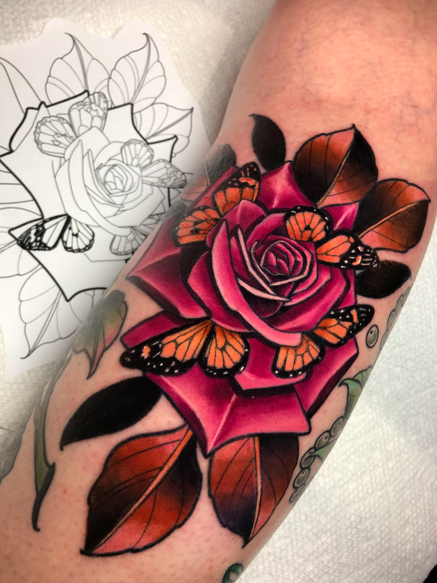 Rose with butterflies American traditional tattoo on the forearm by Melissa Brown