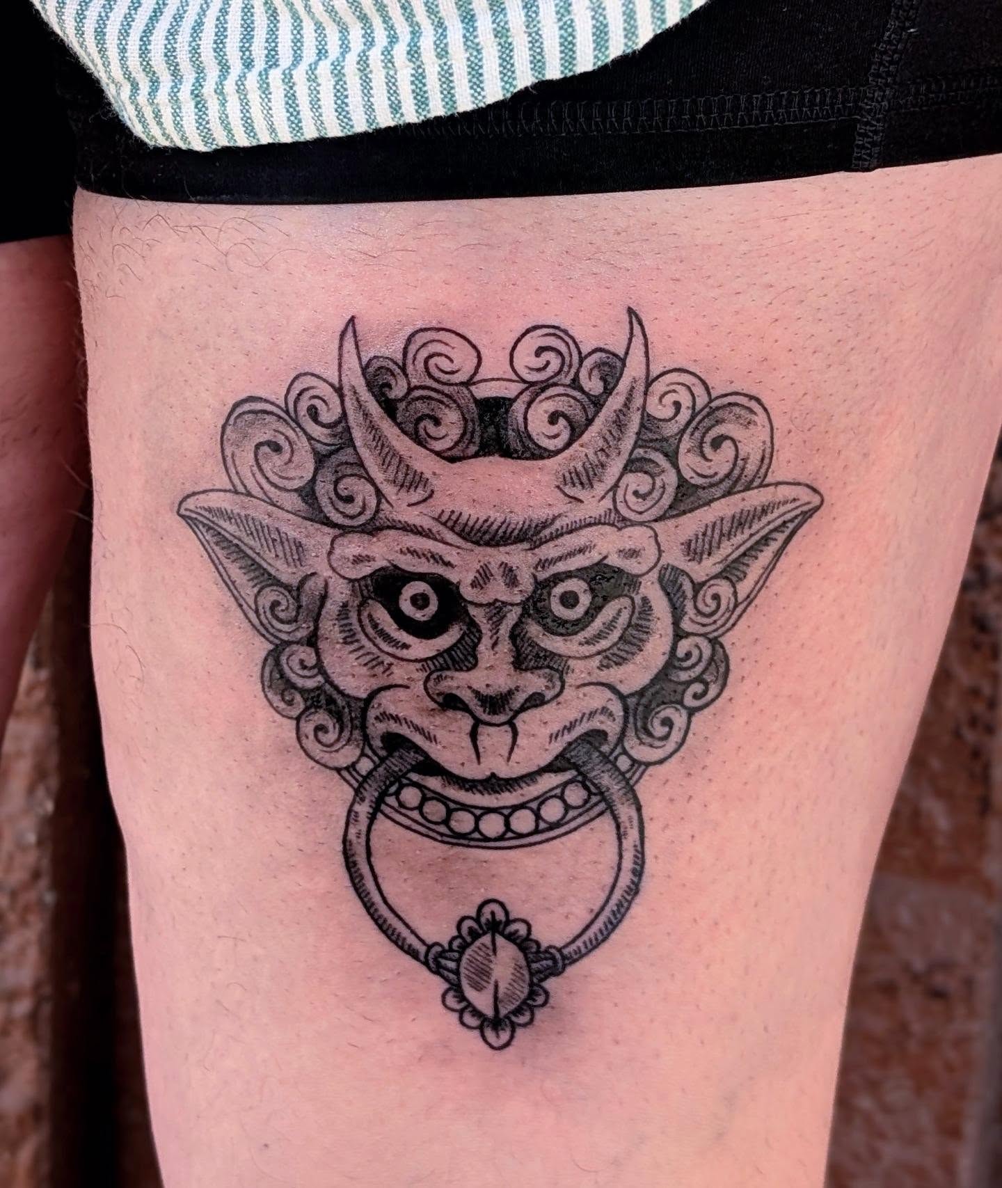 Demon mask black and grey tattoo on the thigh by Ari 💠🧜‍♂️🐟🎨🦑🐚💠