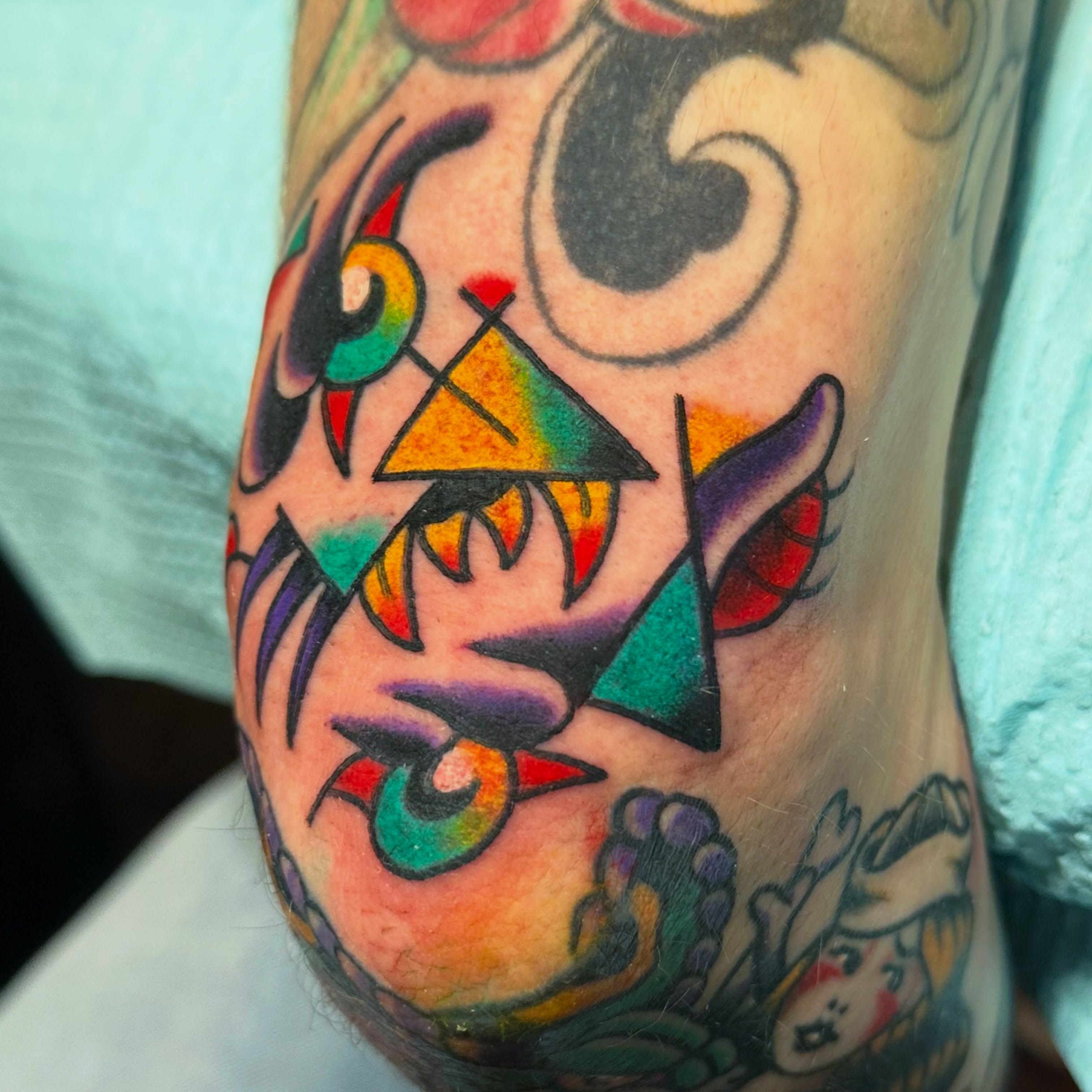 Geometric mask geometric tattoo on the forearm by Kiki Painmaker Trad Tattooer 🧨